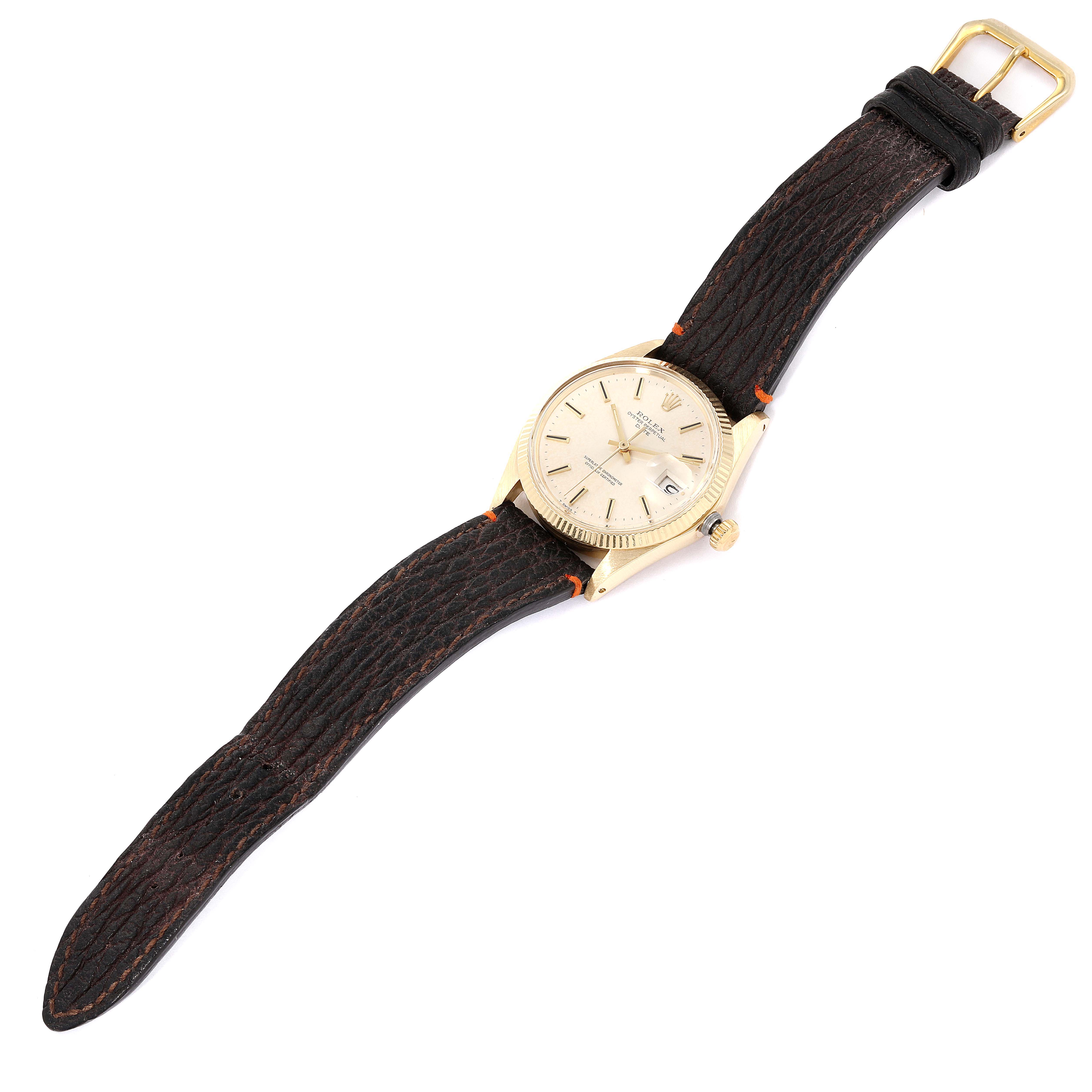 The image shows a Rolex Vintage Collection 1503 Men's Yellow Gold Silver Dial 1503 Men's Yellow Gold Silver Dial watch with a gold case, cream dial, brown leather strap, and gold buckle, viewed from a top-down angle.