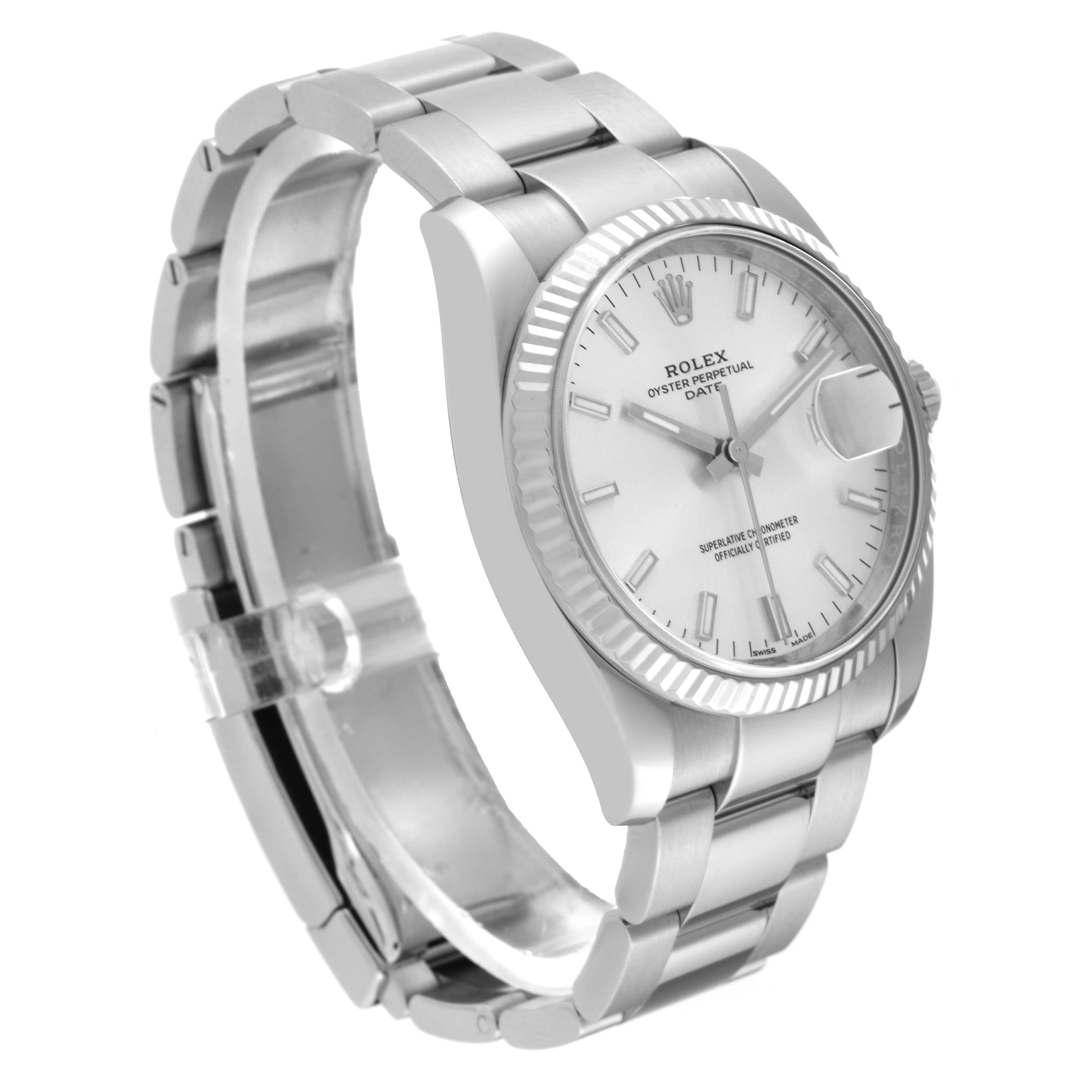 This image shows a Rolex Date 115234 Men's Stainless Steel Silver Dial 115234 Men's Stainless Steel Silver Dial model watch from a three-quarter angle, highlighting the bracelet, dial, and fluted bezel.