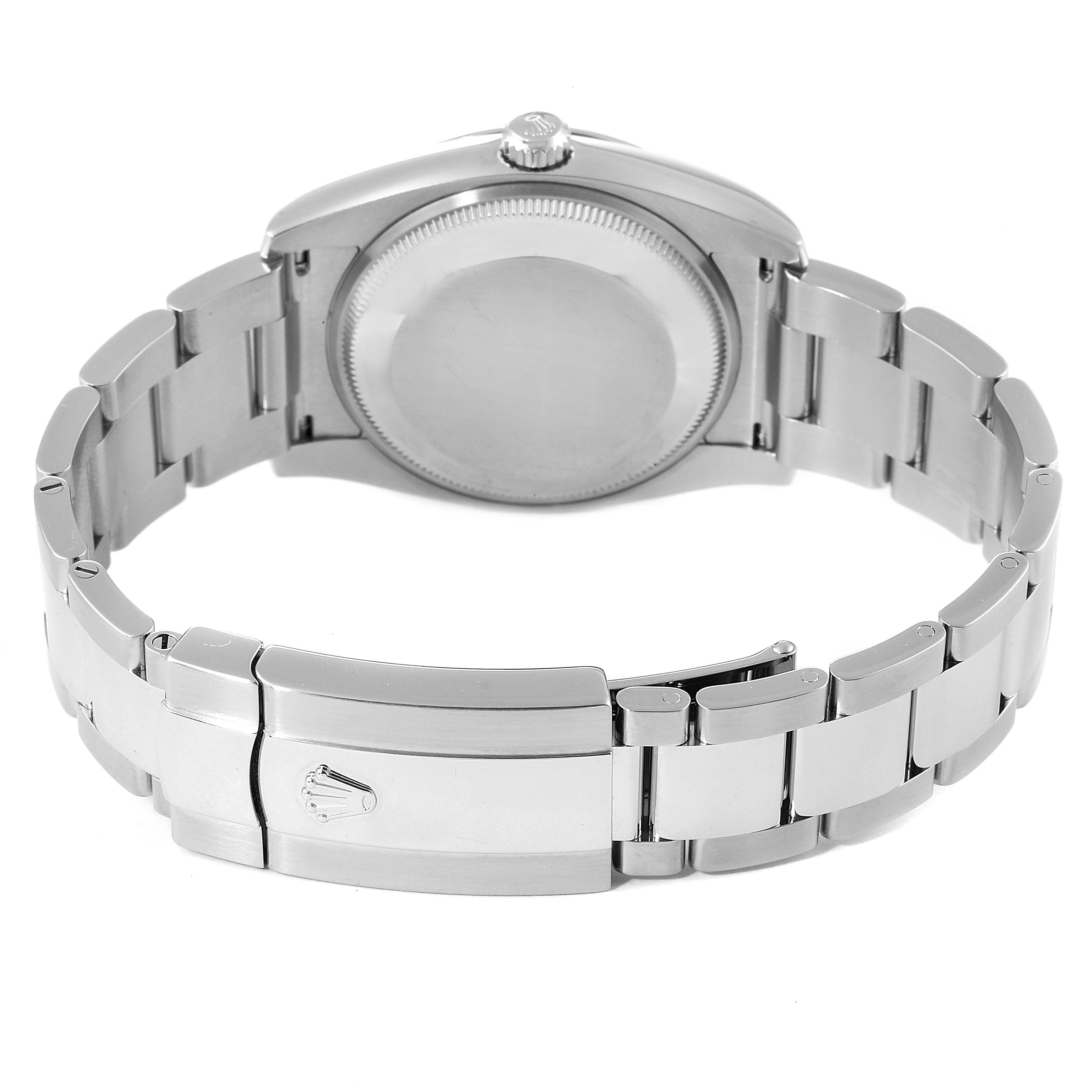 The image shows the back view of a Rolex Date 115200 Men's Stainless Steel Black Dial 115200 Men's Stainless Steel Black Dial model watch, highlighting the case back, crown, and bracelet with clasp.