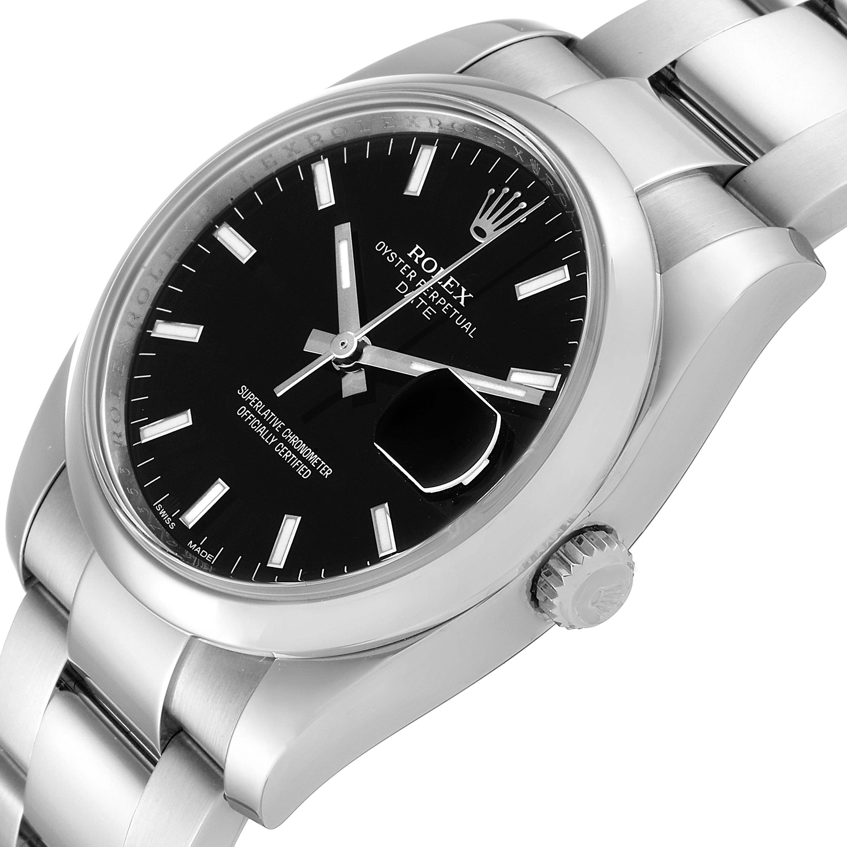 The image shows a close-up of a Rolex Date 115200 Men's Stainless Steel Black Dial 115200 Men's Stainless Steel Black Dial model watch at an oblique angle, highlighting the dial, crown, and bracelet.