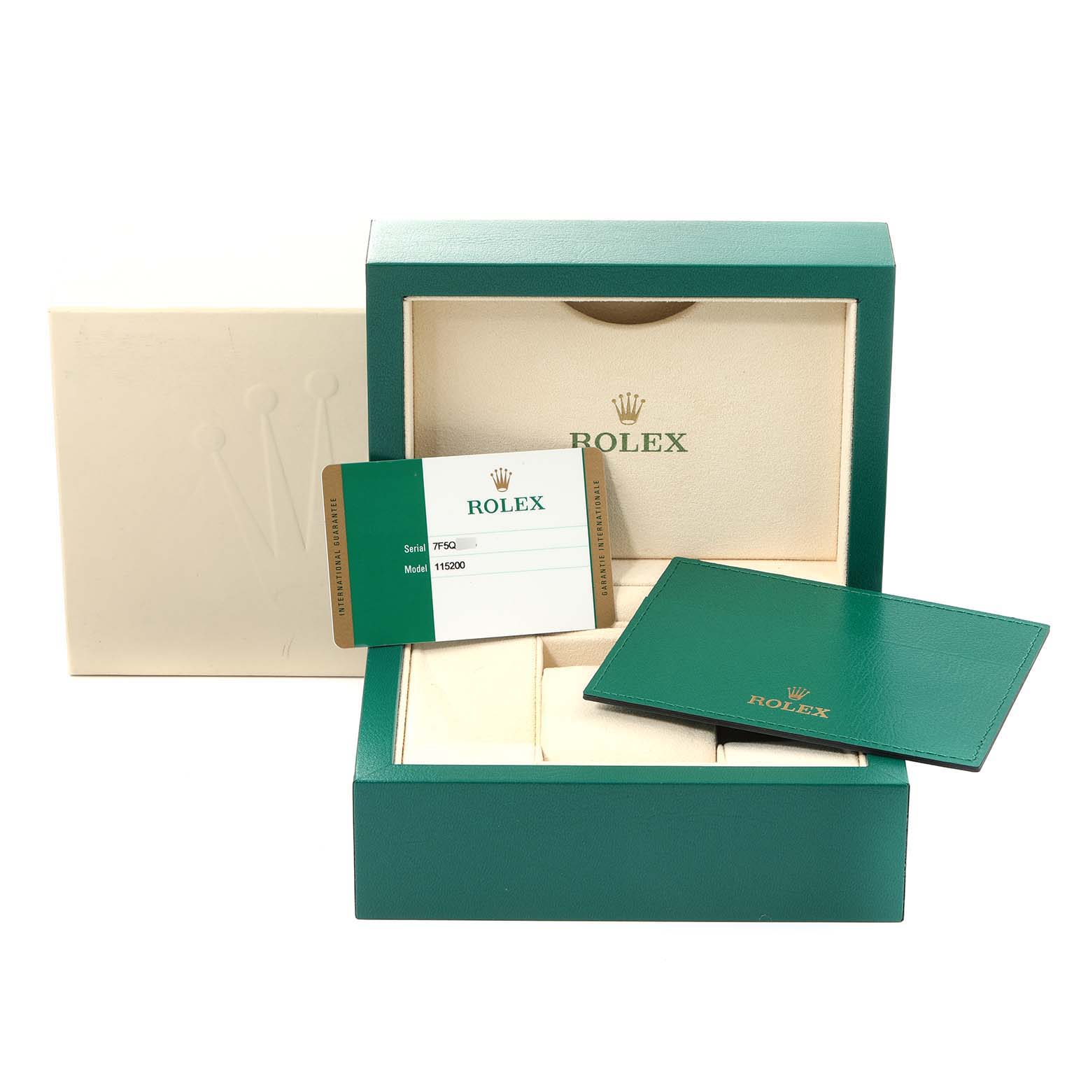 This image shows the box, warranty card, and papers for a Rolex Date 115200 Men's Stainless Steel Black Dial 115200 Men's Stainless Steel Black Dial model watch.
