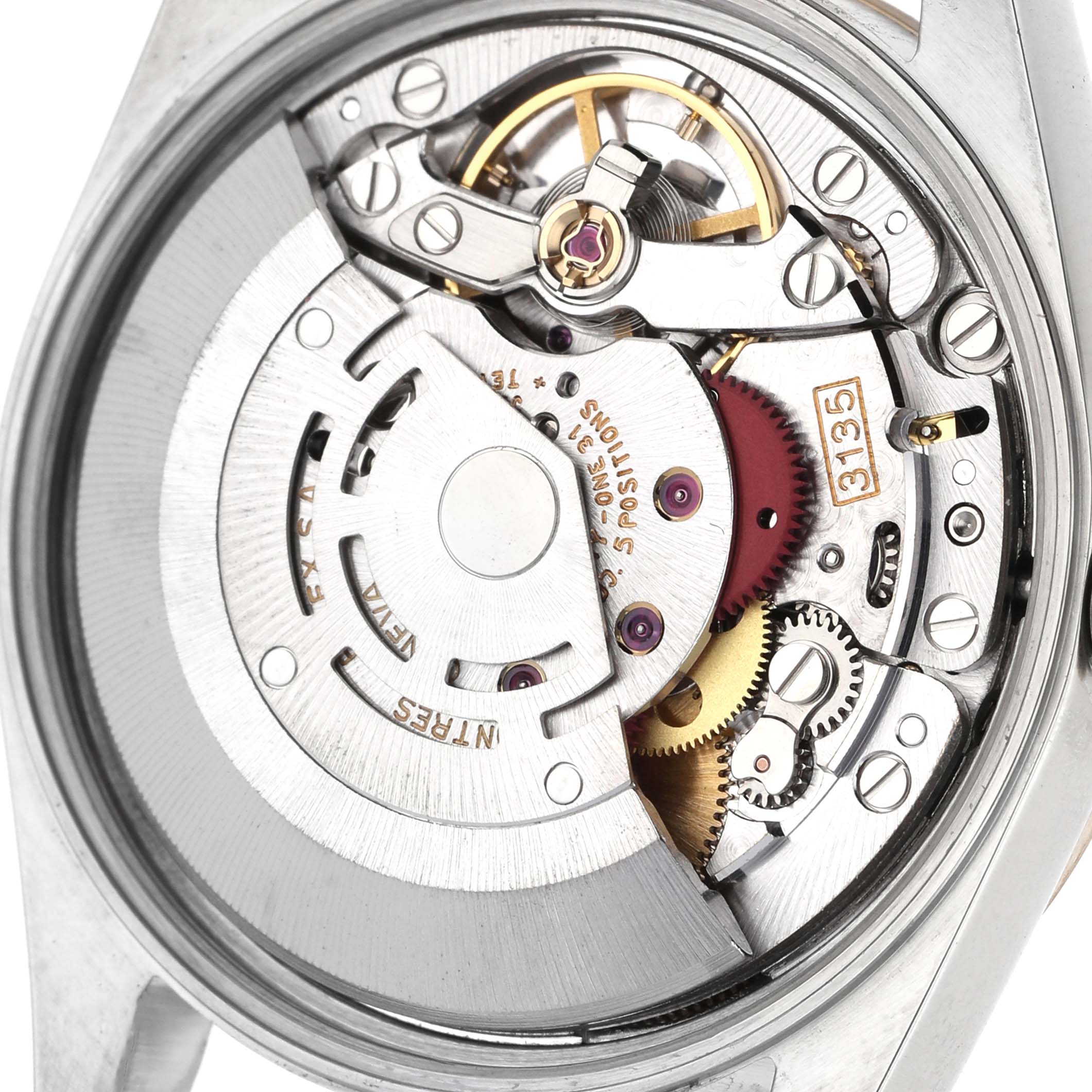 The image shows the movement of a Rolex Date 15223 Men's Steel and Gold (two tone) Champagne Dial model watch from a top-down angle, revealing gears and intricate mechanical parts.