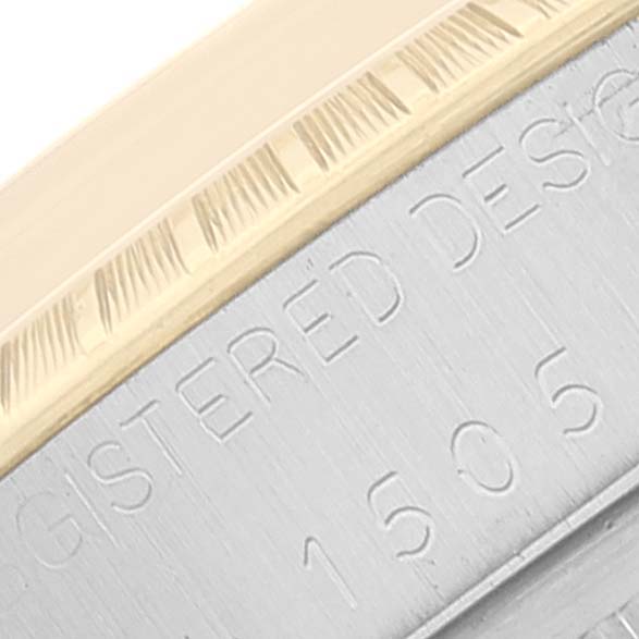 This close-up image shows the edge of the bezel and case of a Rolex Vintage Collection 1505 Men
s Steel and Gold (two tone) Champagne Dial 1505 Men
s Steel and Gold (two tone) Champagne Dial watch, highlighting the inscription.