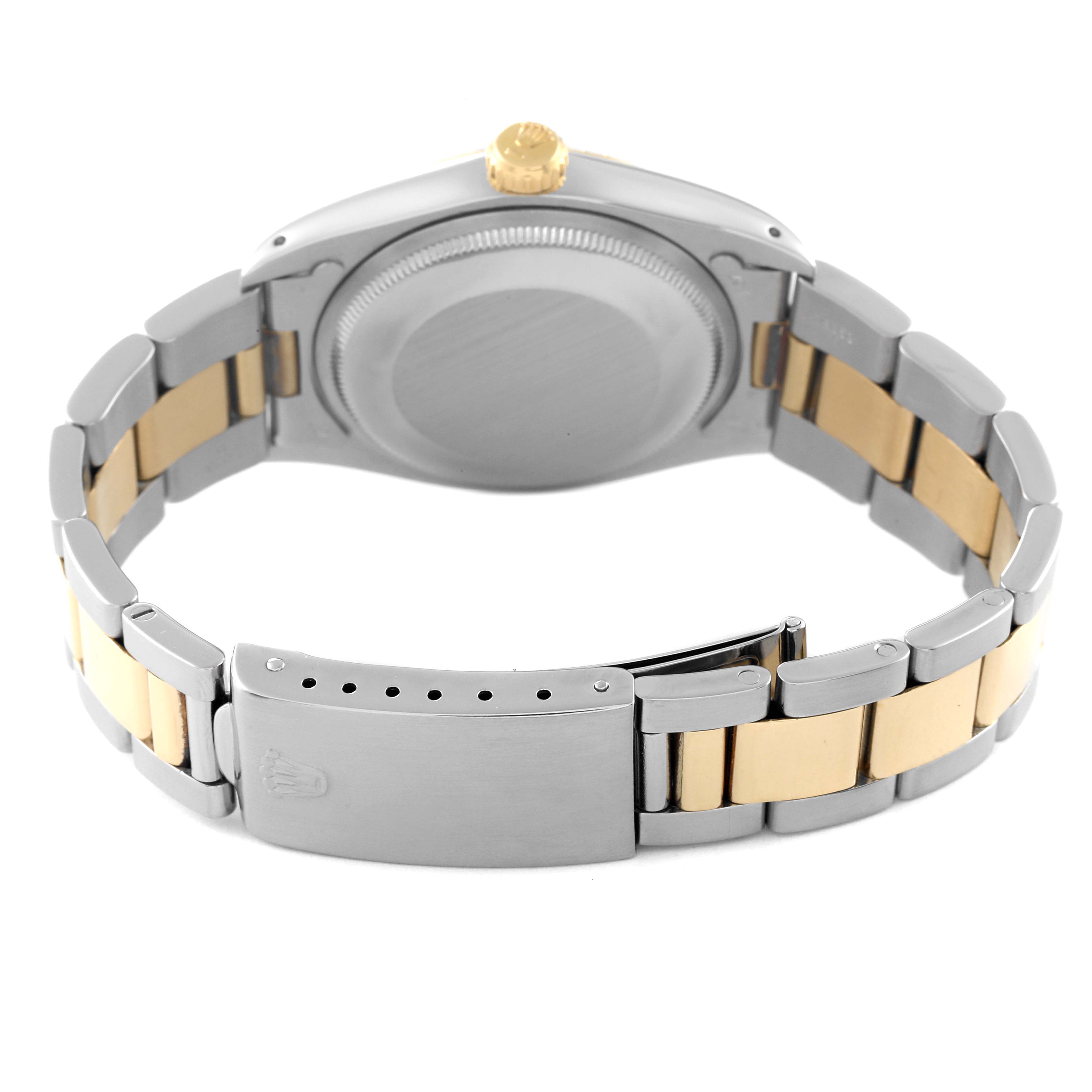 The image shows the backside and the bracelet of the Vintage Collection model by Rolex, emphasizing the clasp and watch case.