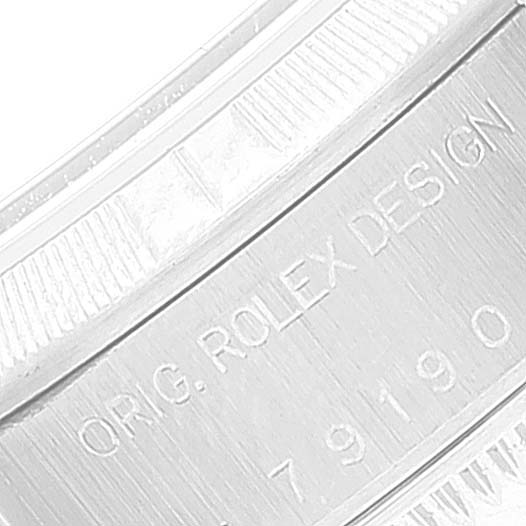 The image shows a close-up angle of the inner side of a Rolex Date 79190 Women's Stainless Steel White Dial 79190 Women's Stainless Steel White Dial model watch, highlighting the engraved model number and "ORIG. ROLEX DESIGN" text.