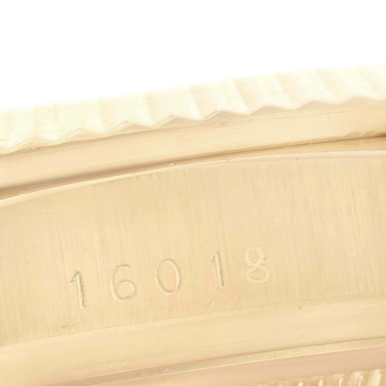 This image shows a close-up of the case side of a Rolex President 16018 Men's Yellow Gold Blue Dial 16018 Men's Yellow Gold Blue Dial model watch with the reference number 16018.