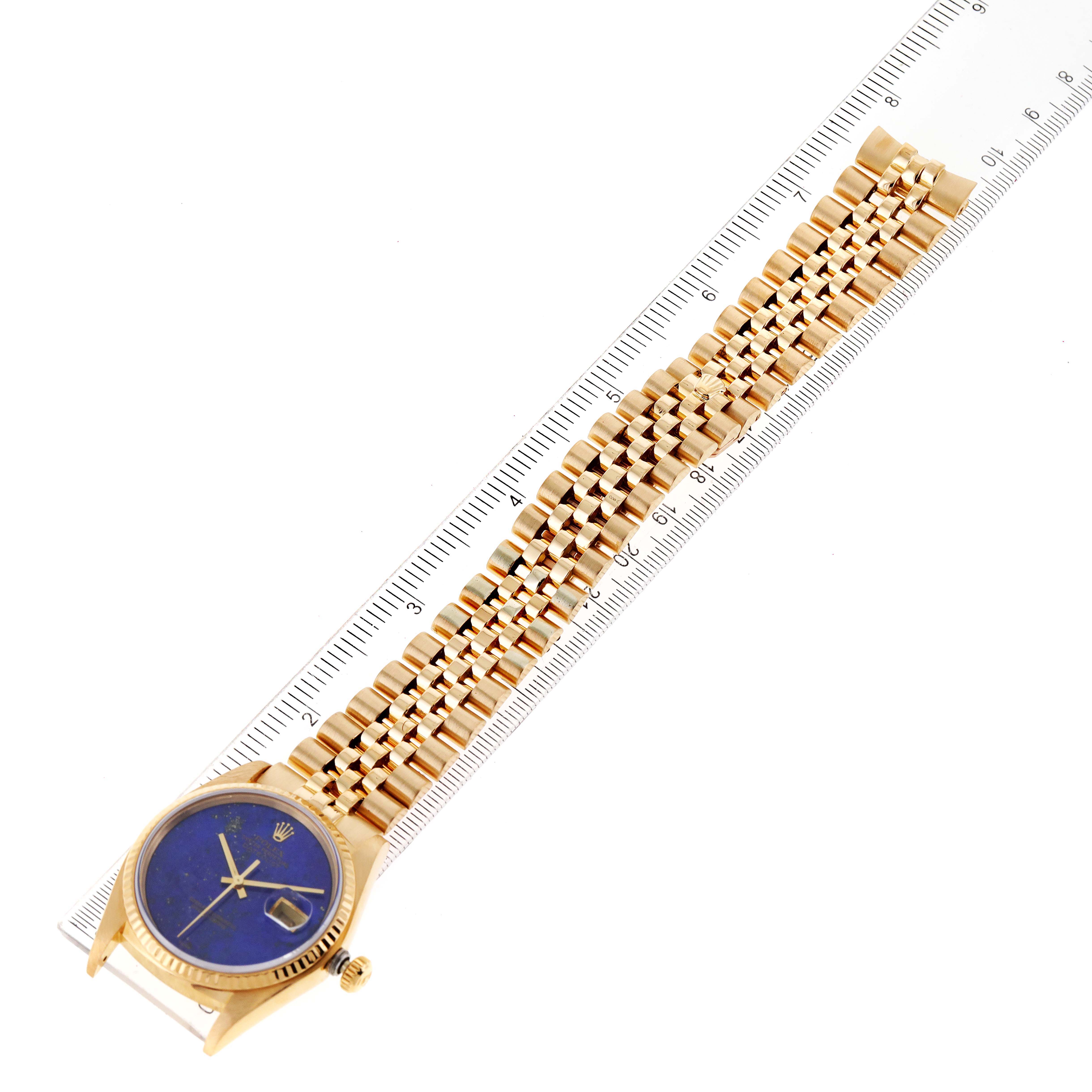 The image shows a Rolex President 16018 Men's Yellow Gold Blue Dial 16018 Men's Yellow Gold Blue Dial model watch laid flat with its face and gold bracelet visible, alongside a ruler for scale.
