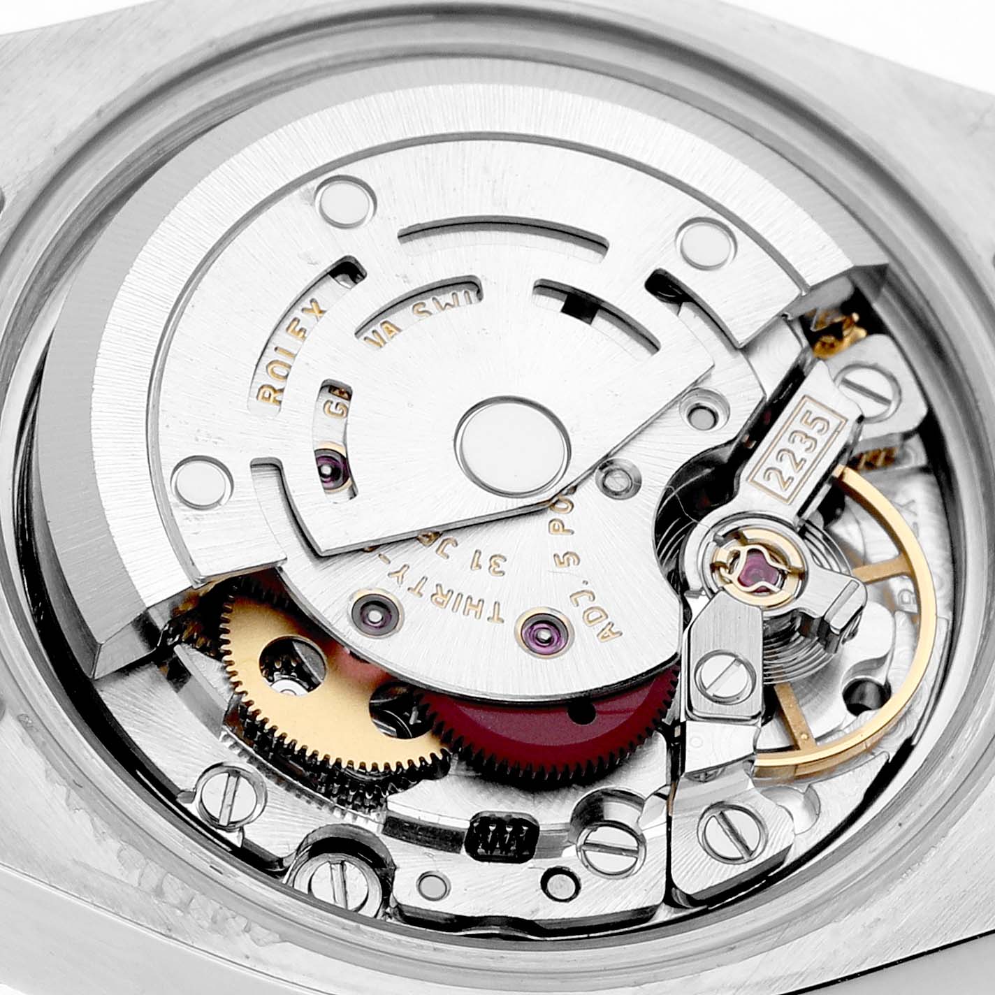The image shows the movement of a Rolex Datejust 179160 Women's Stainless Steel White Dial watch, focusing on the intricate inner mechanical parts from a direct overhead angle.