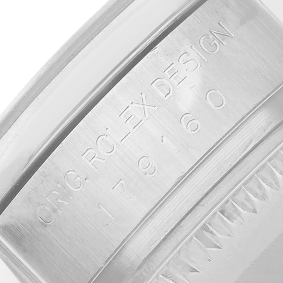 The image shows a close-up of the inner bezel engraving on a Rolex Datejust 179160 Women's Stainless Steel White Dial watch.