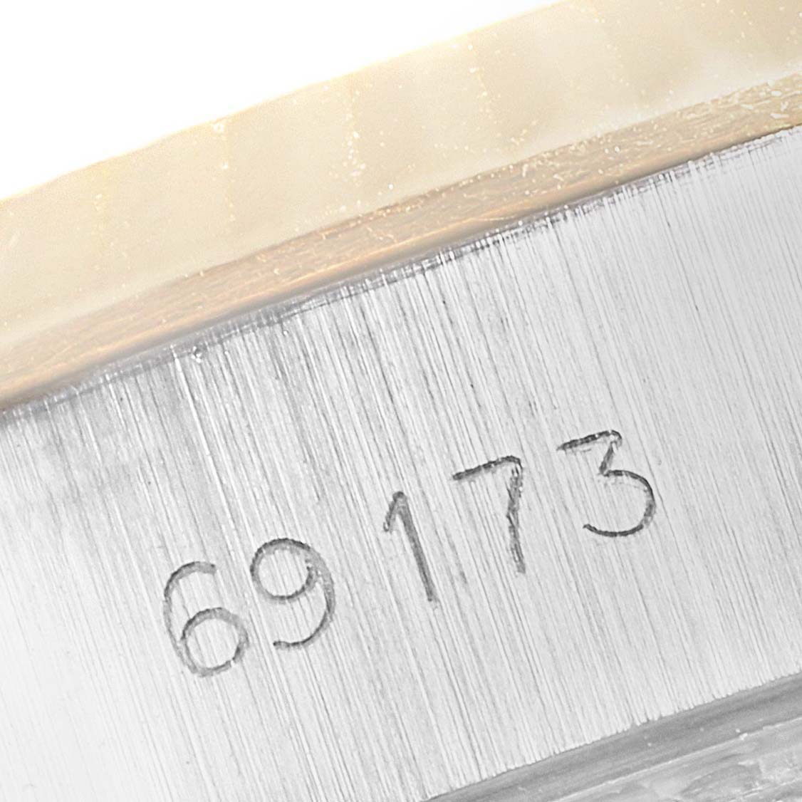 This image shows a close-up of the watch’s case side with the model number "69173" engraved on a Rolex Datejust 69173 Women
s Steel and Gold (two tone) Black Dial 69173 Women
s Steel and Gold (two tone) Black Dial.