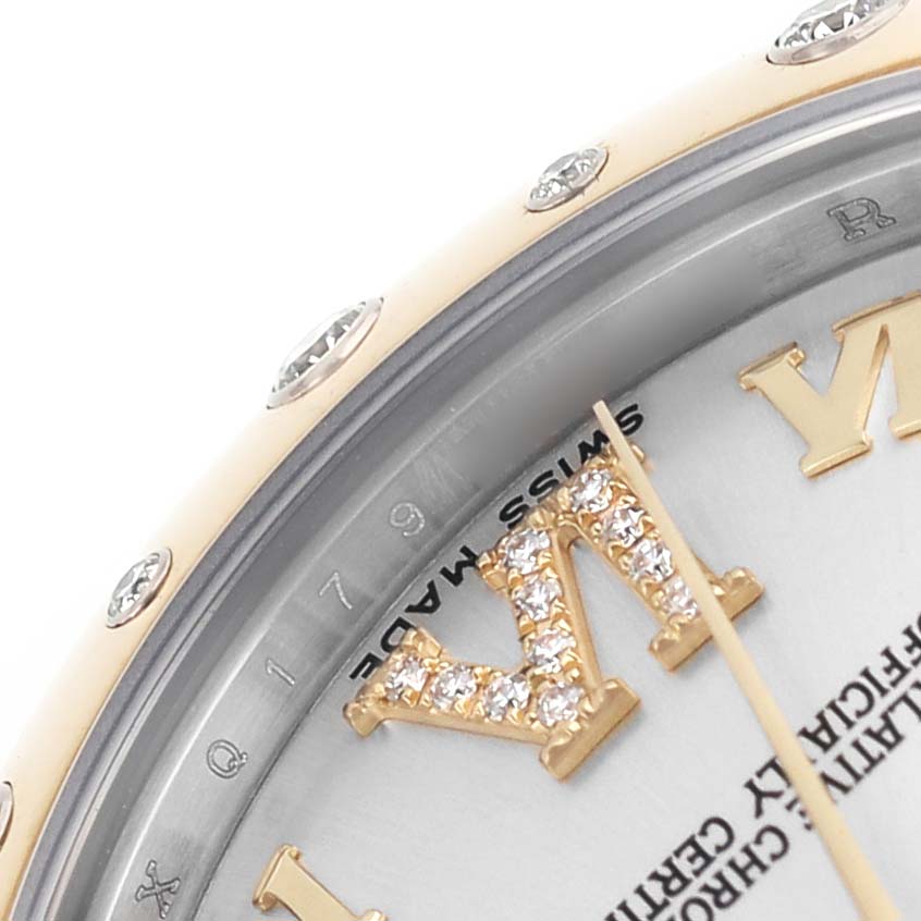 The image shows a close-up of the Rolex Mid-Size 178343 Women's Steel and Gold (two tone) Silver Dial model's bezel, dial edge, and jeweled Roman numeral markers.