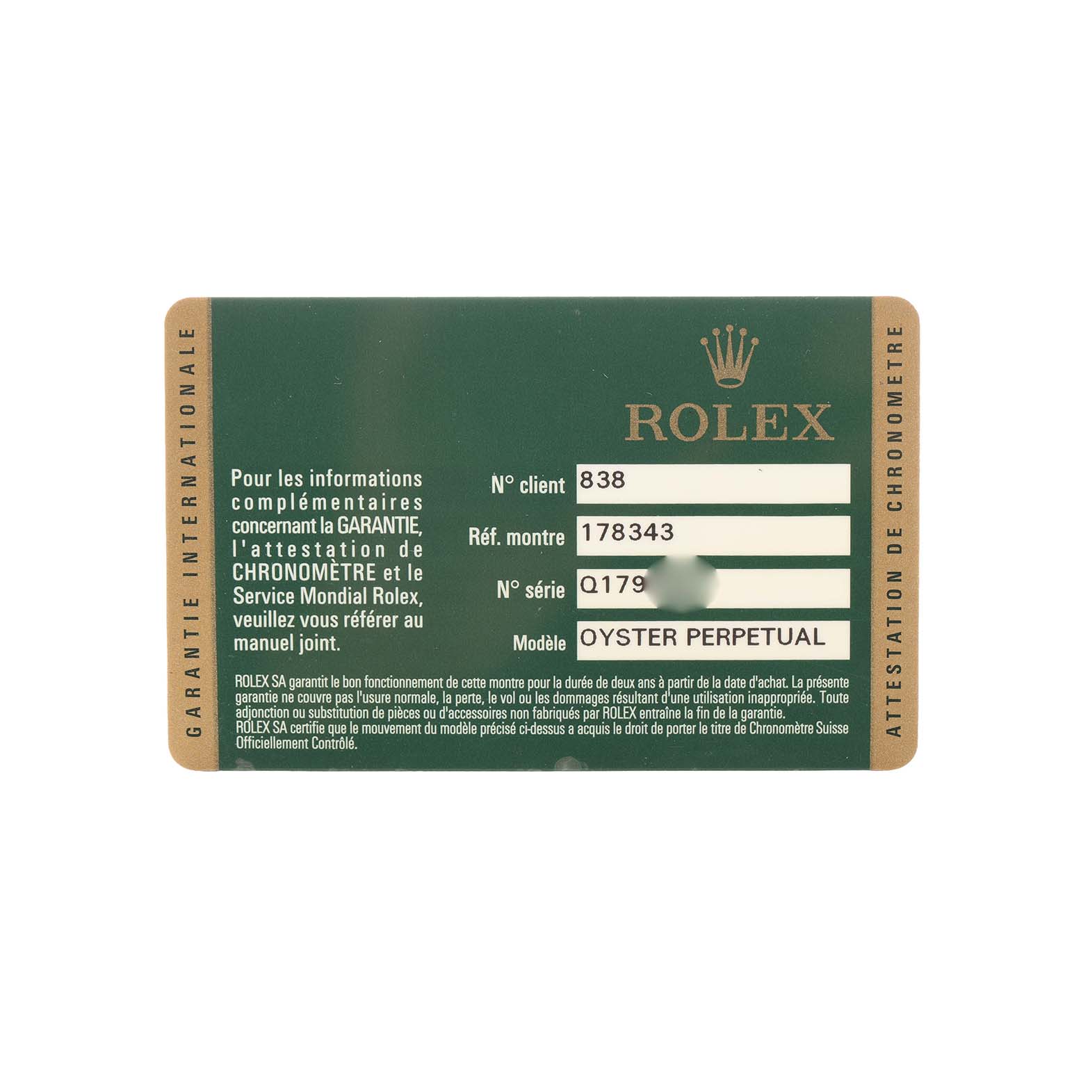 This image shows a warranty card for a Mid-Size Rolex Oyster Perpetual model, displaying reference and serial numbers.