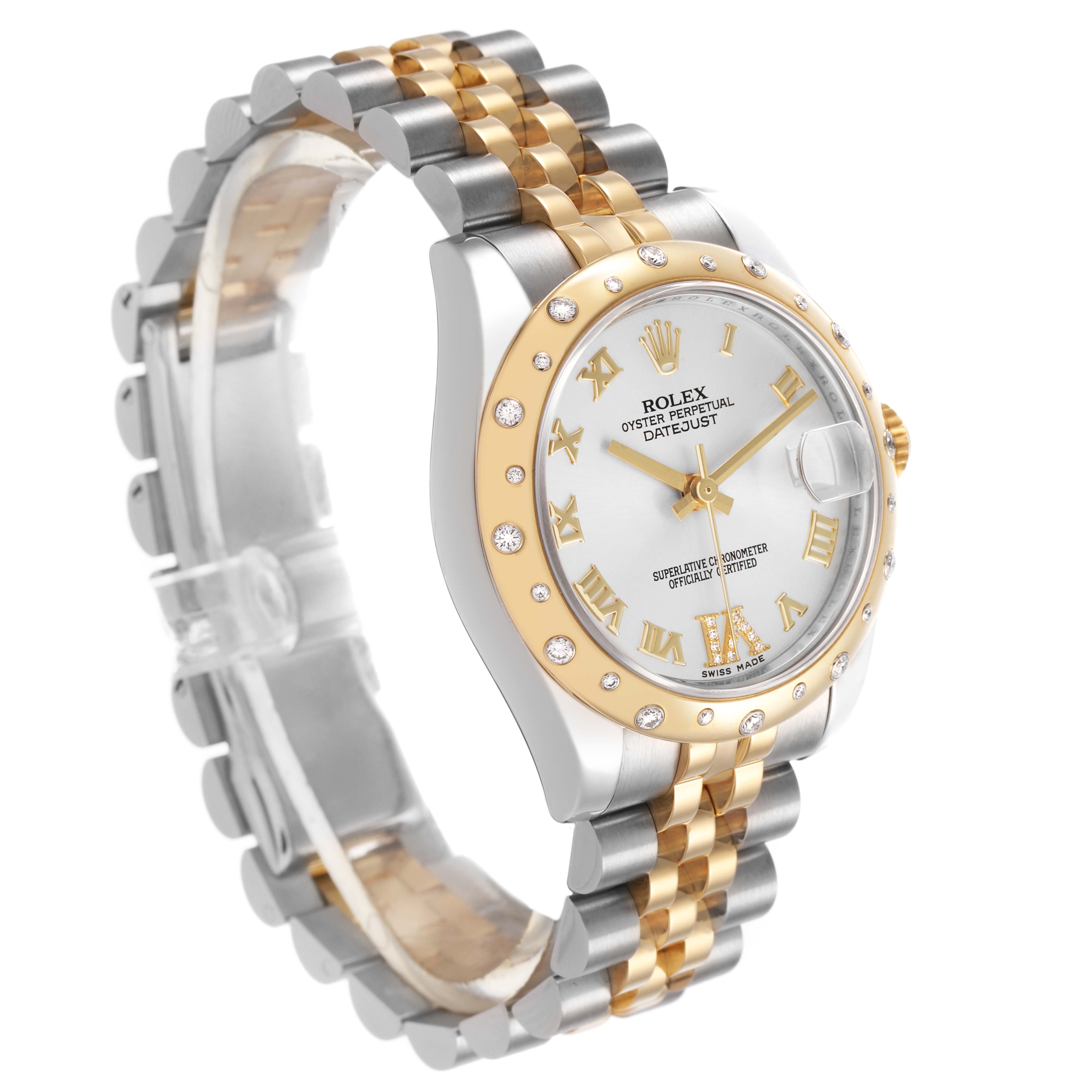 The Rolex Mid-Size 178343 Women's Steel and Gold (two tone) Silver Dial model watch is shown at a 3/4 angle, highlighting the two-tone band, diamond bezel, and white dial with gold Roman numerals.