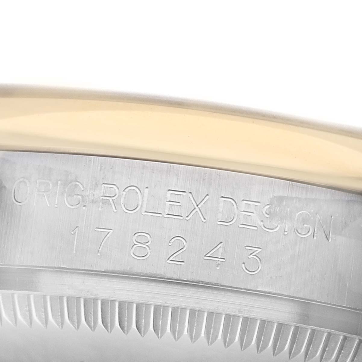 The image shows a close-up of the side of a Rolex Datejust 178243 Women's Steel and Gold (two tone) Silver Dial, highlighting the engraved model number and bezel details.