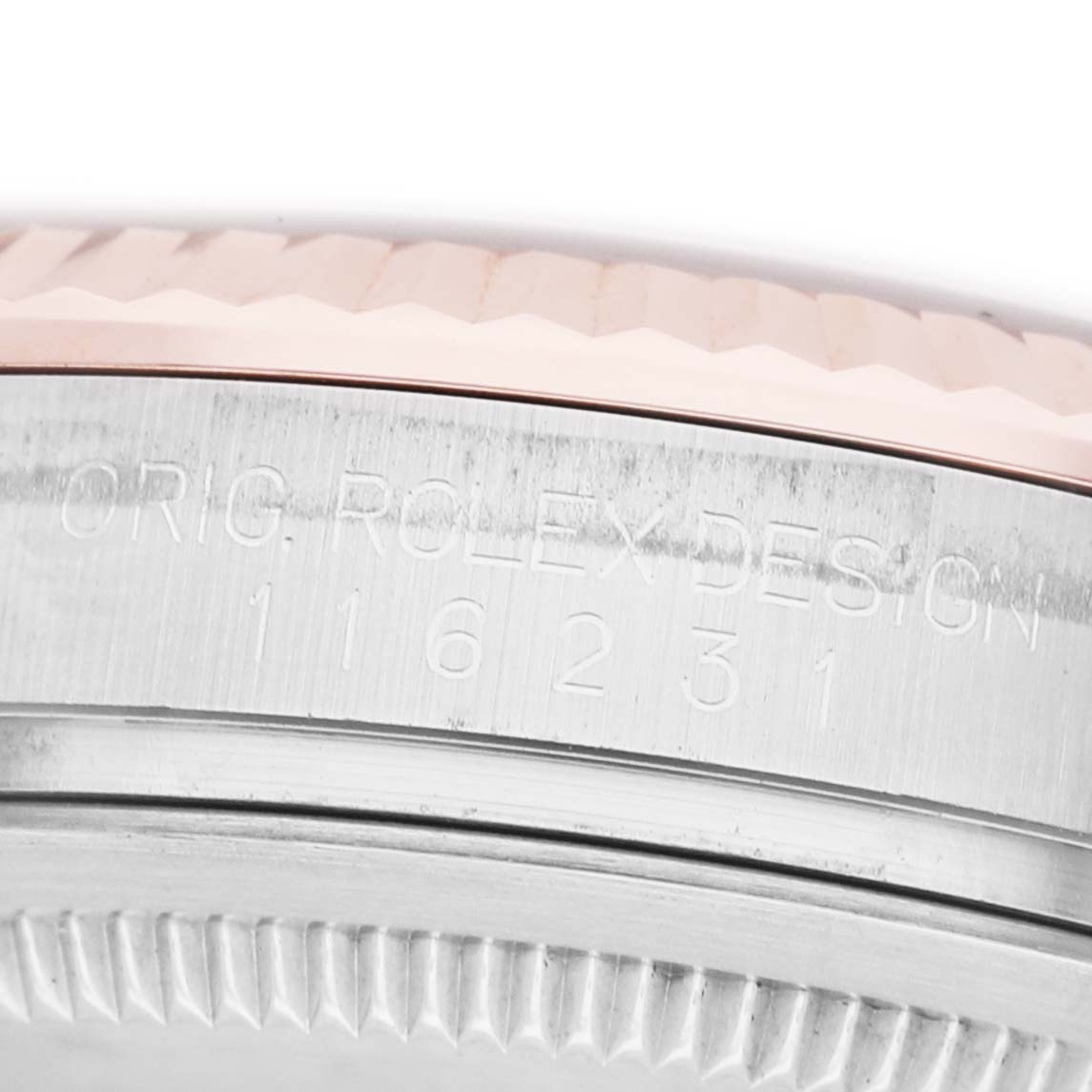 The image shows the side of a Rolex Datejust 116231 Men's Steel and Gold (two tone) Mother of Pearl Dial watch, focusing on the case with engraved model details.
