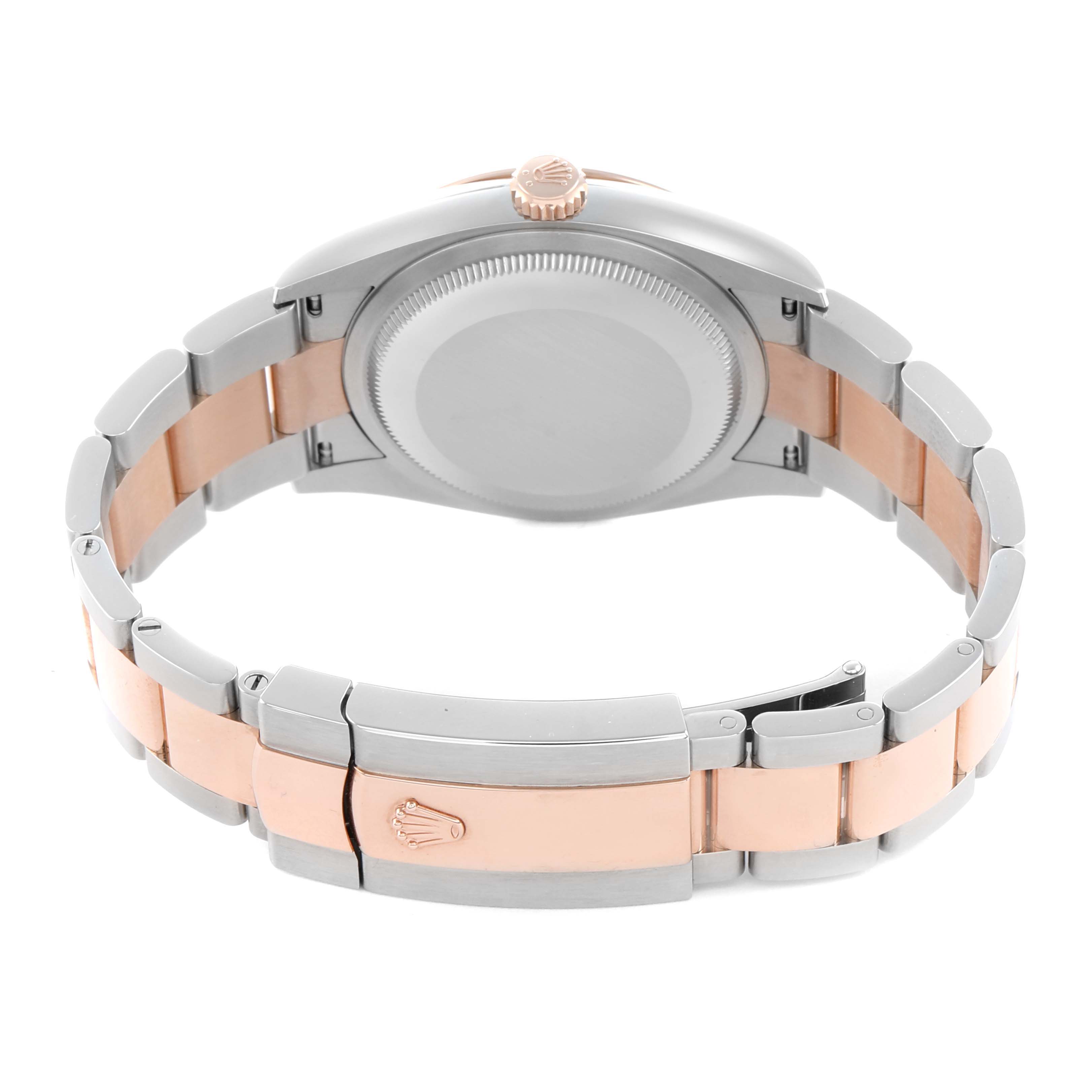 The image shows the back of a Rolex Datejust 126201 Men's Steel and Gold (two tone) Grey Dial watch, highlighting the case back, crown, and two-tone bracelet with clasp.