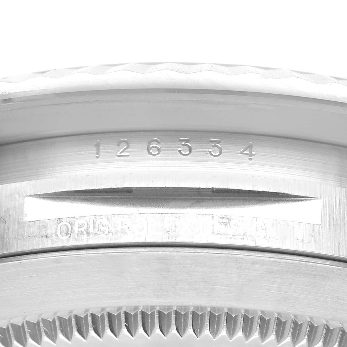 The image shows a close-up of the serial and model numbers engraved on the side of the case of a Rolex Datejust 41 126334 Men
s Stainless Steel Black Dial 126334 Men
s Stainless Steel Black Dial watch.