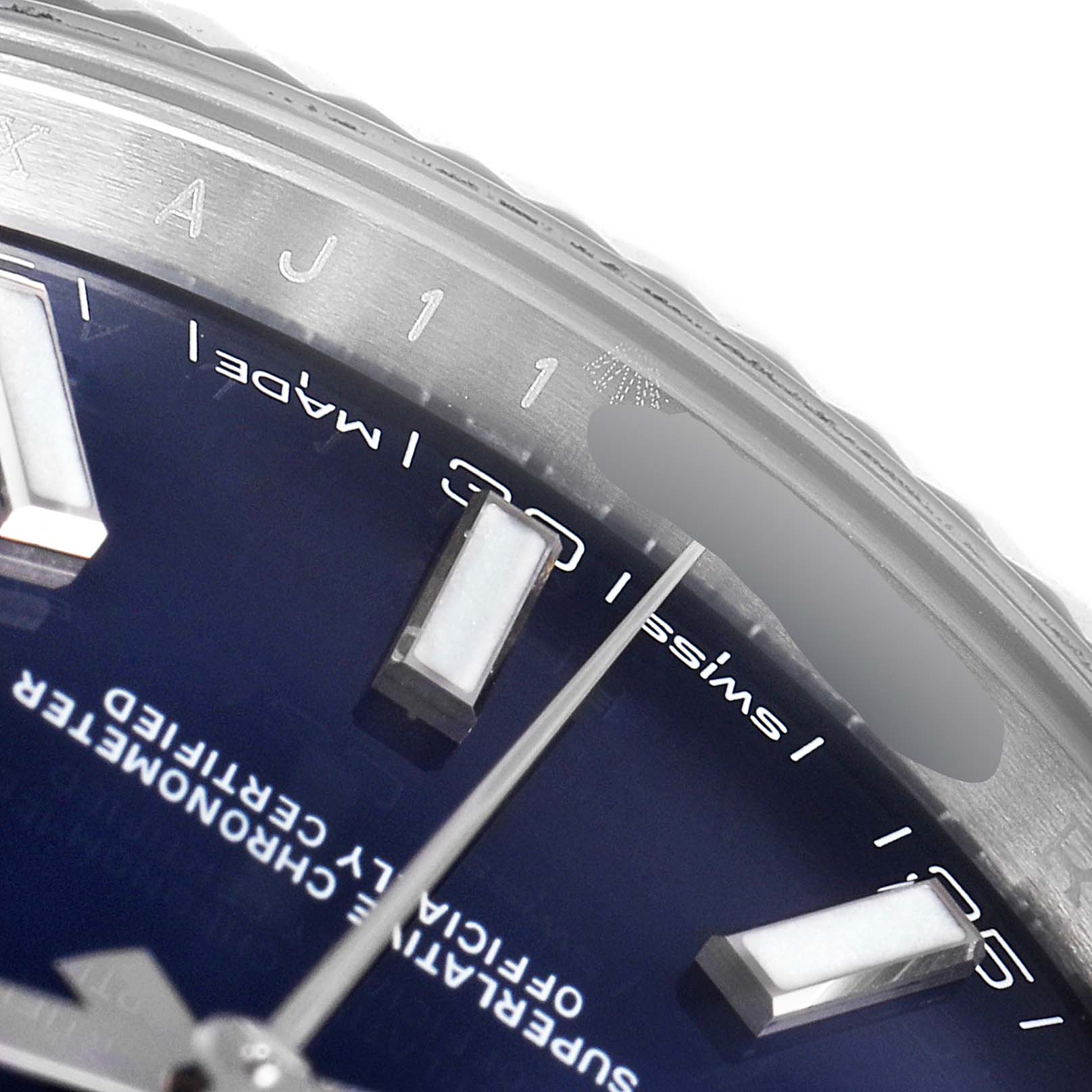 This image shows a close-up of the dial and bezel of a Rolex Datejust 41 126334 Men's Stainless Steel Blue Dial 126334 Men's Stainless Steel Blue Dial, highlighting the Swiss Made label and part of the hour indices.