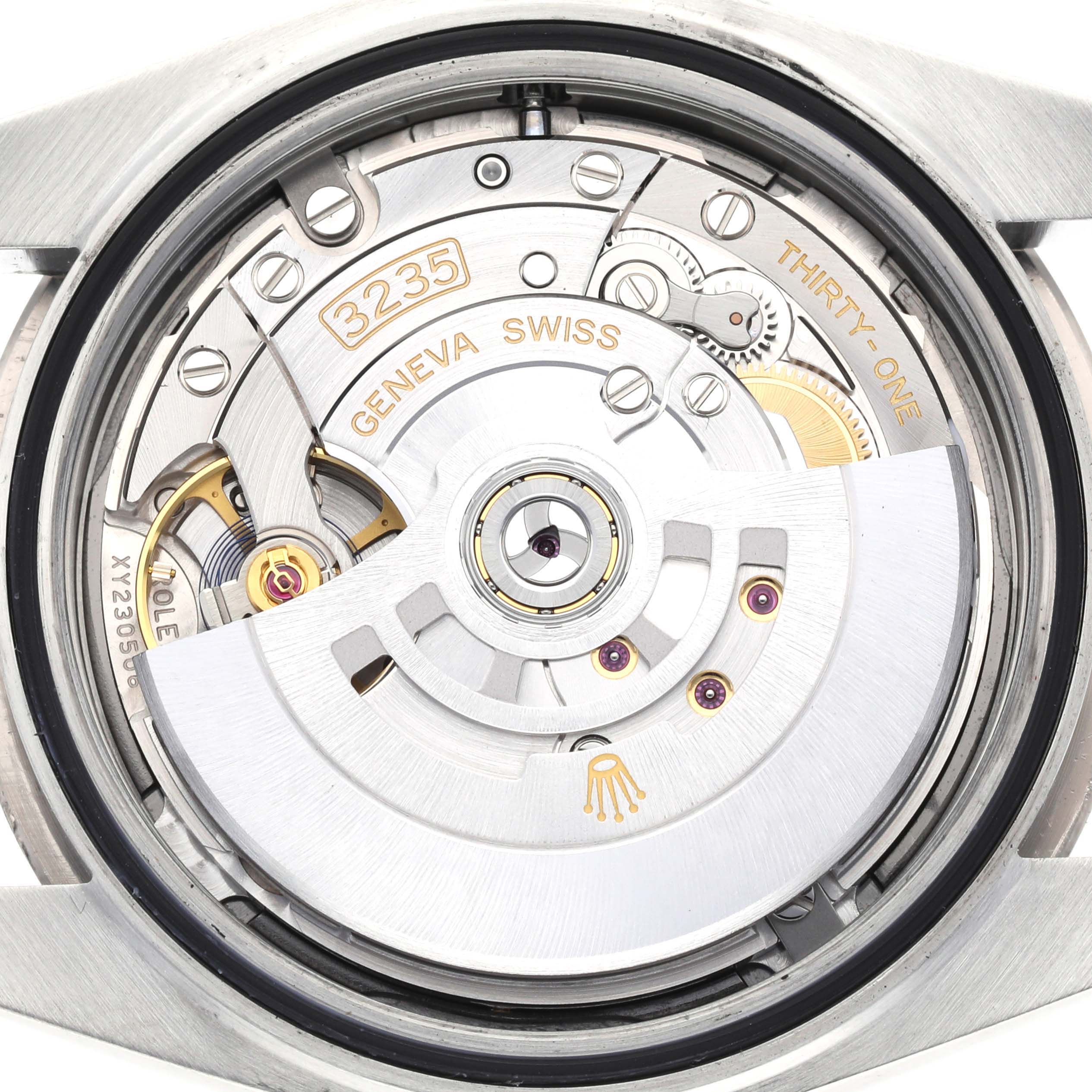 The image shows a close-up of the movement (caliber 3235) of a Rolex Datejust 41 126334 Men
s Stainless Steel Blue Dial 126334 Men
s Stainless Steel Blue Dial watch from the back.