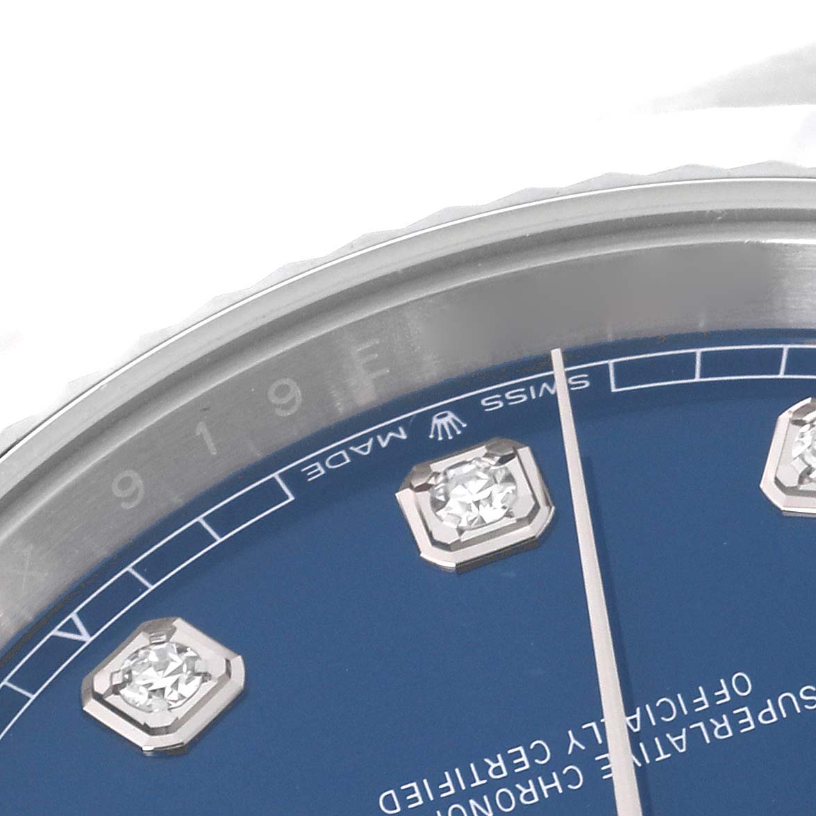 This image shows a close-up of the Rolex Datejust 41 126334 Men
s Stainless Steel Blue Dial 126334 Men
s Stainless Steel Blue Dial
s dial and bezel, focusing on the diamonds and "Swiss Made" text.