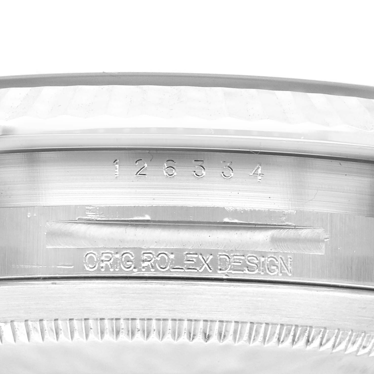 The image shows the reference number and original design inscription on the case side of a Rolex Datejust 41 126334 Men
s Stainless Steel Blue Dial 126334 Men
s Stainless Steel Blue Dial model.