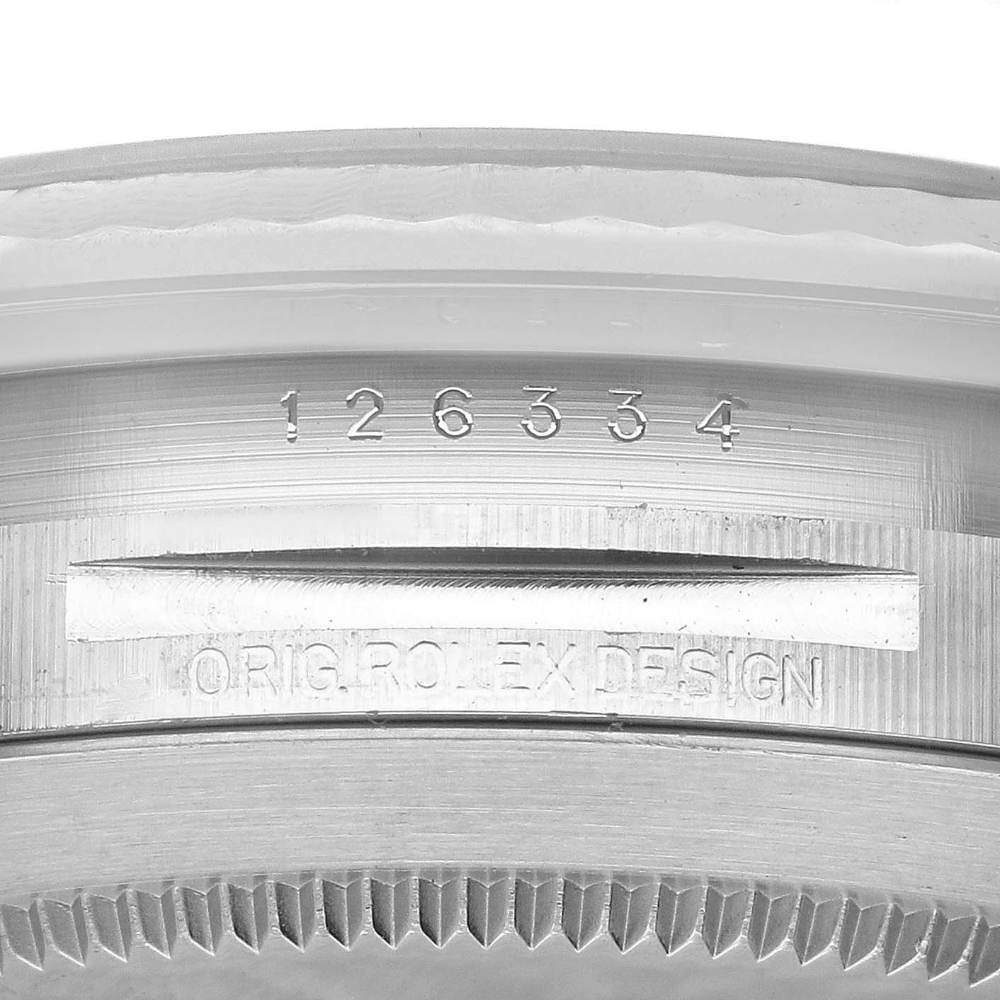 This image shows a close-up of the edge and serial number inscription of a Rolex Datejust 41 126334 Men's Stainless Steel Black Dial 126334 Men's Stainless Steel Black Dial watch case.