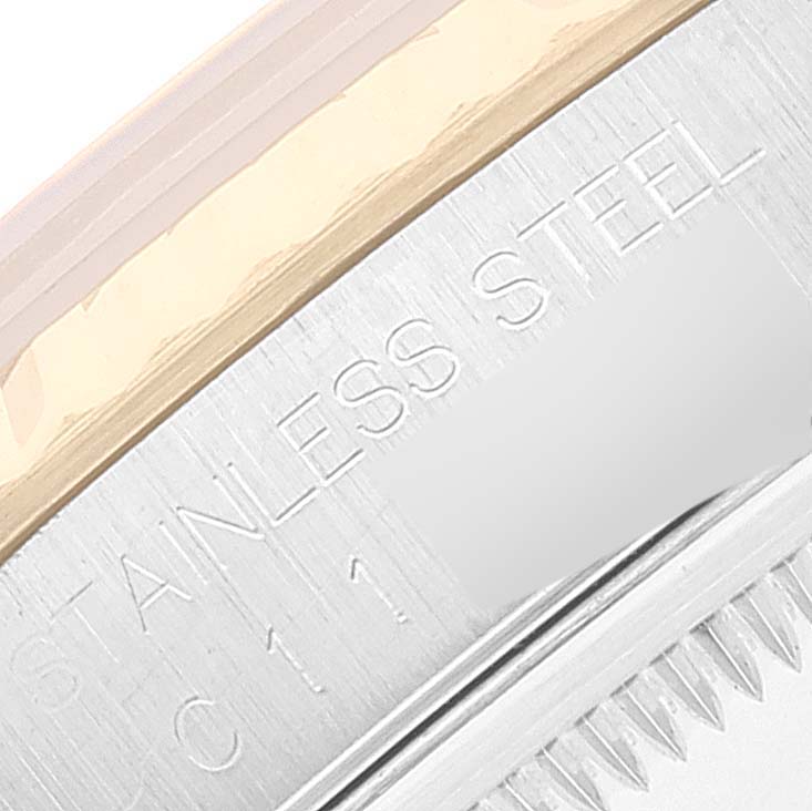 This close-up image of the Rolex Datejust 16233 Men's Steel and Gold (two tone) Champagne Dial 16233 Men's Steel and Gold (two tone) Champagne Dial watch shows the stainless steel case and part of the bezel.