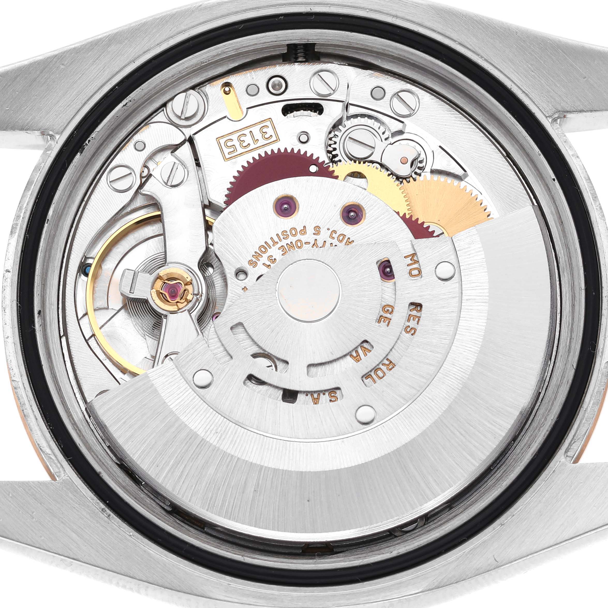 The image shows the Rolex Datejust 116231 Men's Steel and Gold (two tone) White Dial watch movement from a rear angle, highlighting gears and components of the caliber 3135.