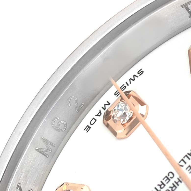 The image shows a close-up of the bezel, dial, and diamond hour marker of a Rolex Datejust 116231 Men's Steel and Gold (two tone) White Dial.