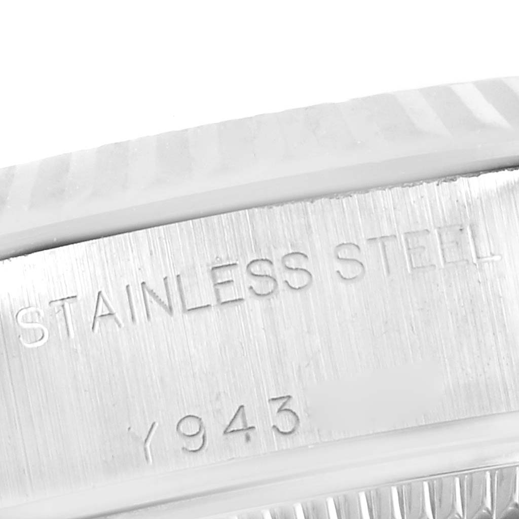 This close-up angle of a Rolex Datejust 79174 Women's Stainless Steel Mother of Pearl Dial 79174 Women's Stainless Steel Mother of Pearl Dial watch shows a section of the case with the "STAINLESS STEEL" engraving.