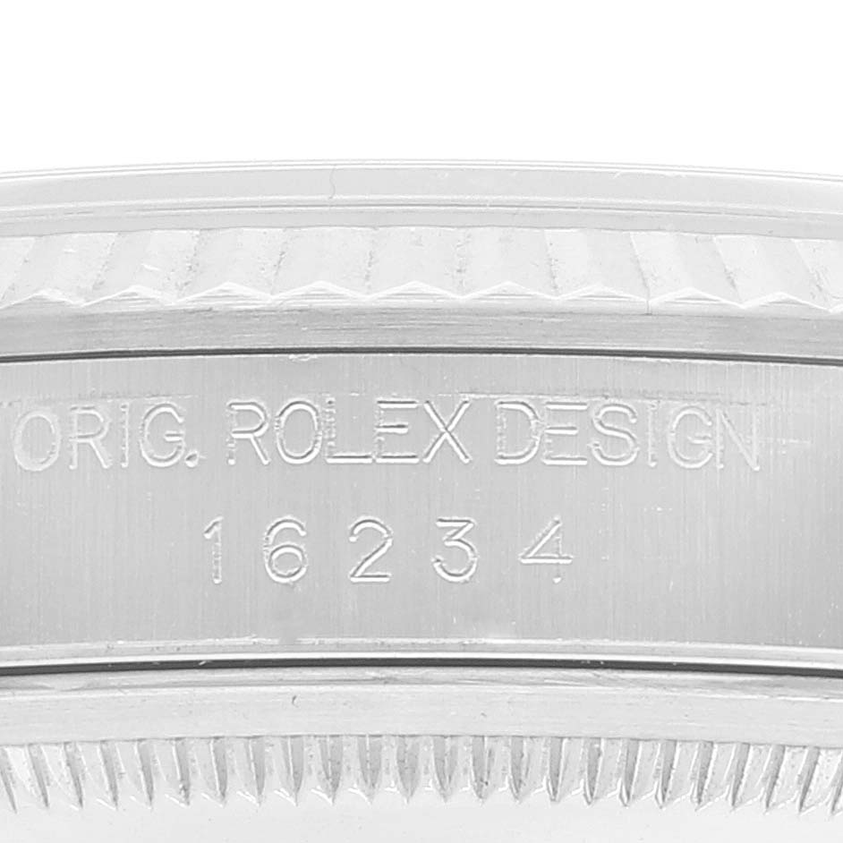 The image shows a close-up of the engraved outer casing of a Rolex Datejust 16234 Men's Stainless Steel Silver Dial 16234 Men's Stainless Steel Silver Dial watch, featuring the model number 16234.