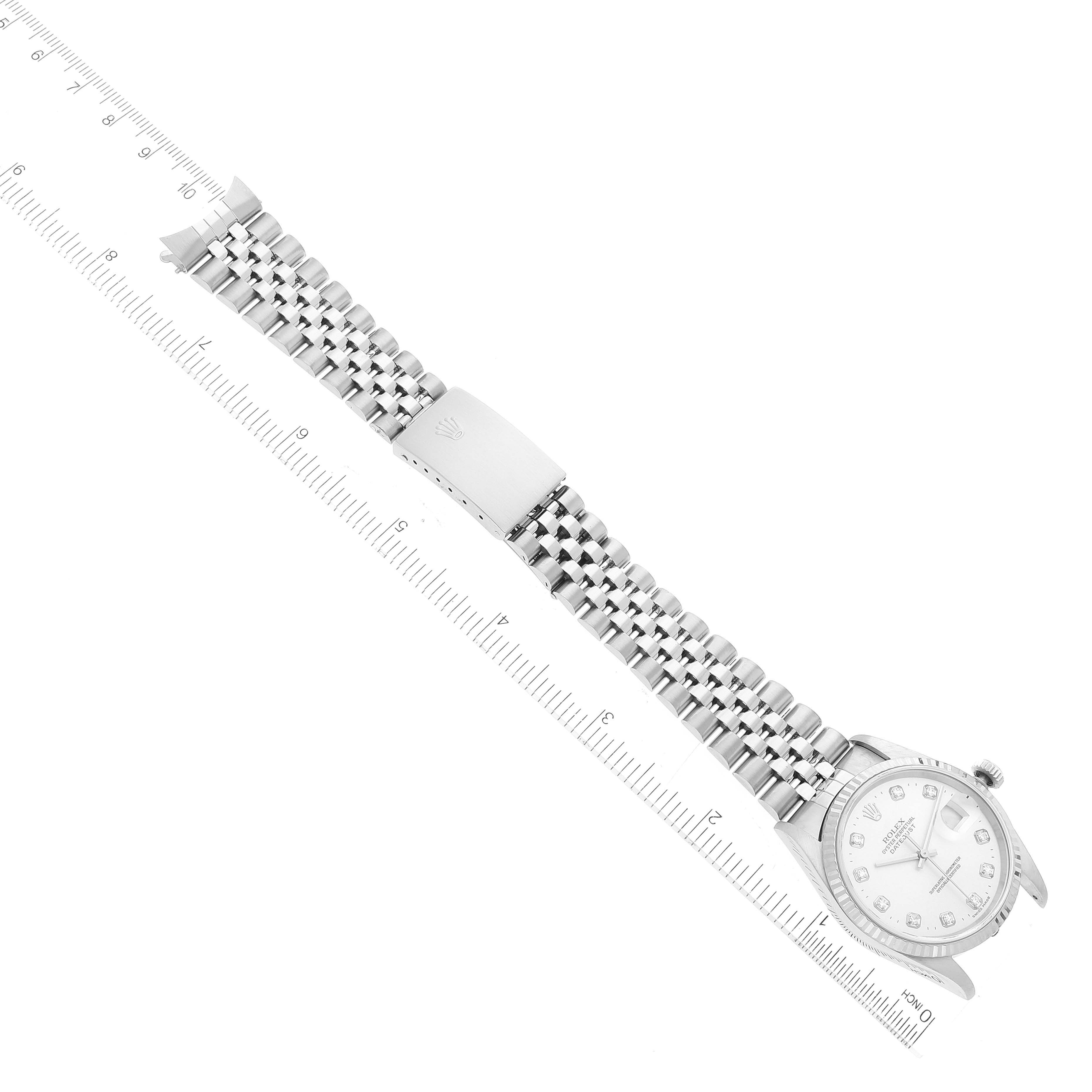 The image shows a top-down view of a Rolex Datejust 16234 Men's Stainless Steel Silver Dial 16234 Men's Stainless Steel Silver Dial watch with its face, bezel, and bracelet strap visible along a ruler.