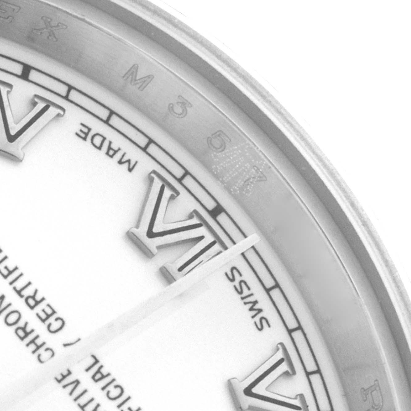 The image shows a close-up of the Rolex Datejust 179174 Women's Stainless Steel White Dial's dial, highlighting the Roman numerals and part of the rehaut.
