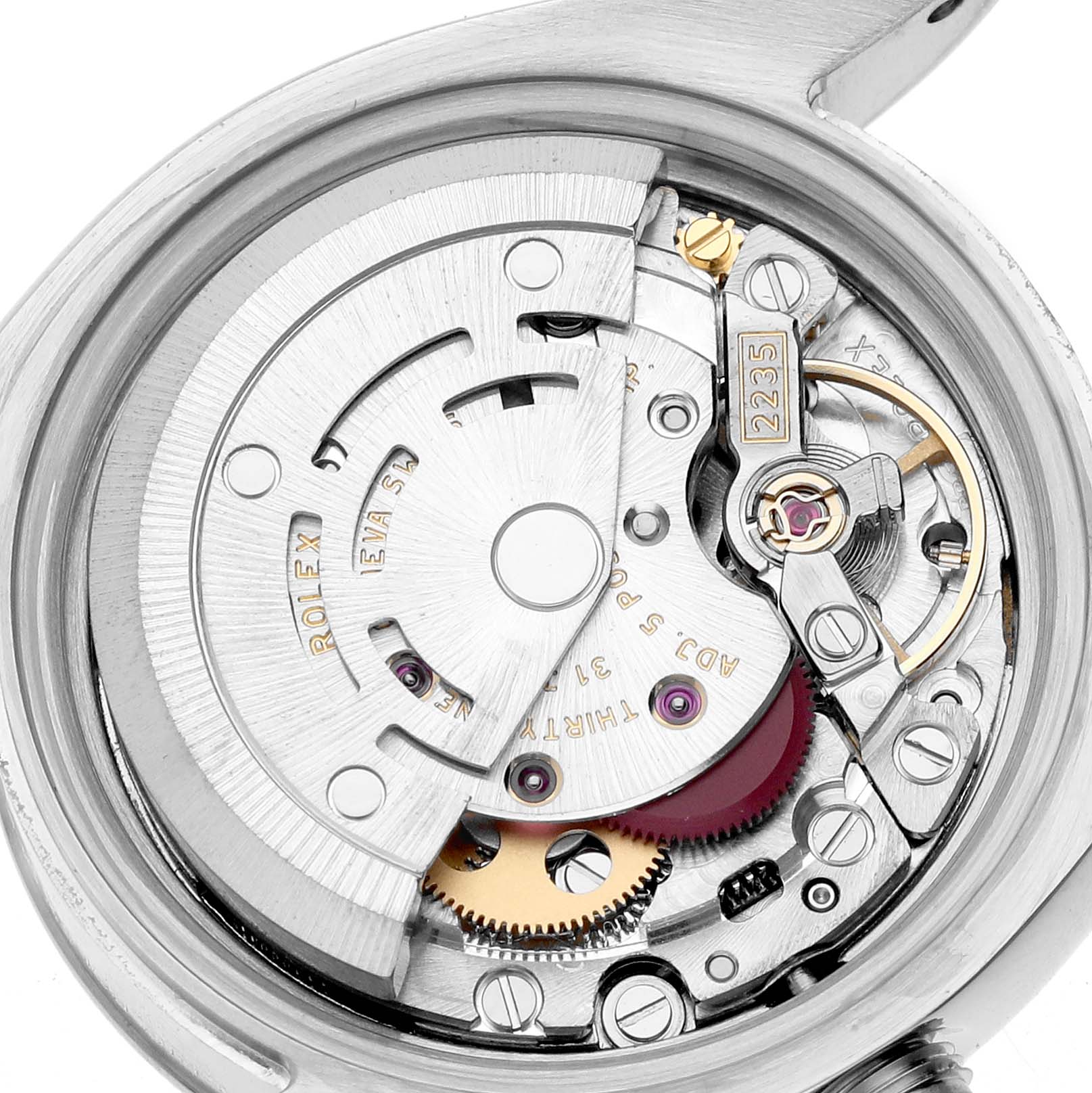 This image shows the inner workings of a Rolex Datejust 179174 Women's Stainless Steel White Dial, focusing on the movement with gears and components visible.