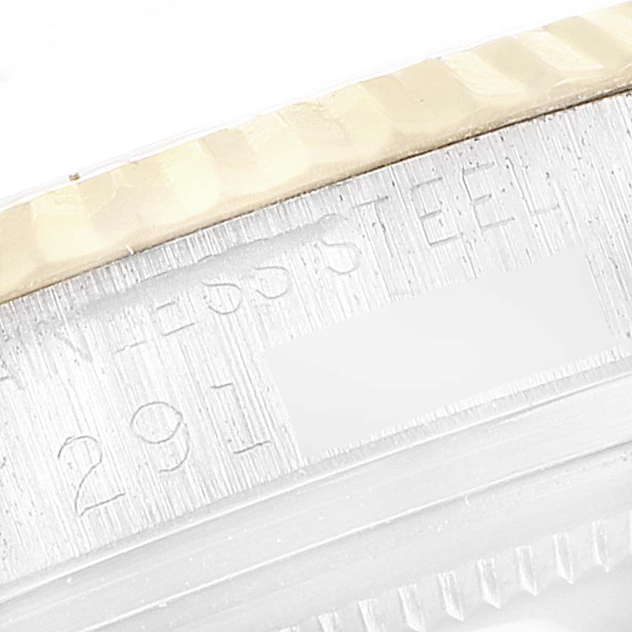 This image shows a close-up of the side engraving on the case of a Rolex Vintage Collection 1601 Men's Steel and Gold (two tone) Champagne Dial 1601 Men's Steel and Gold (two tone) Champagne Dial watch.