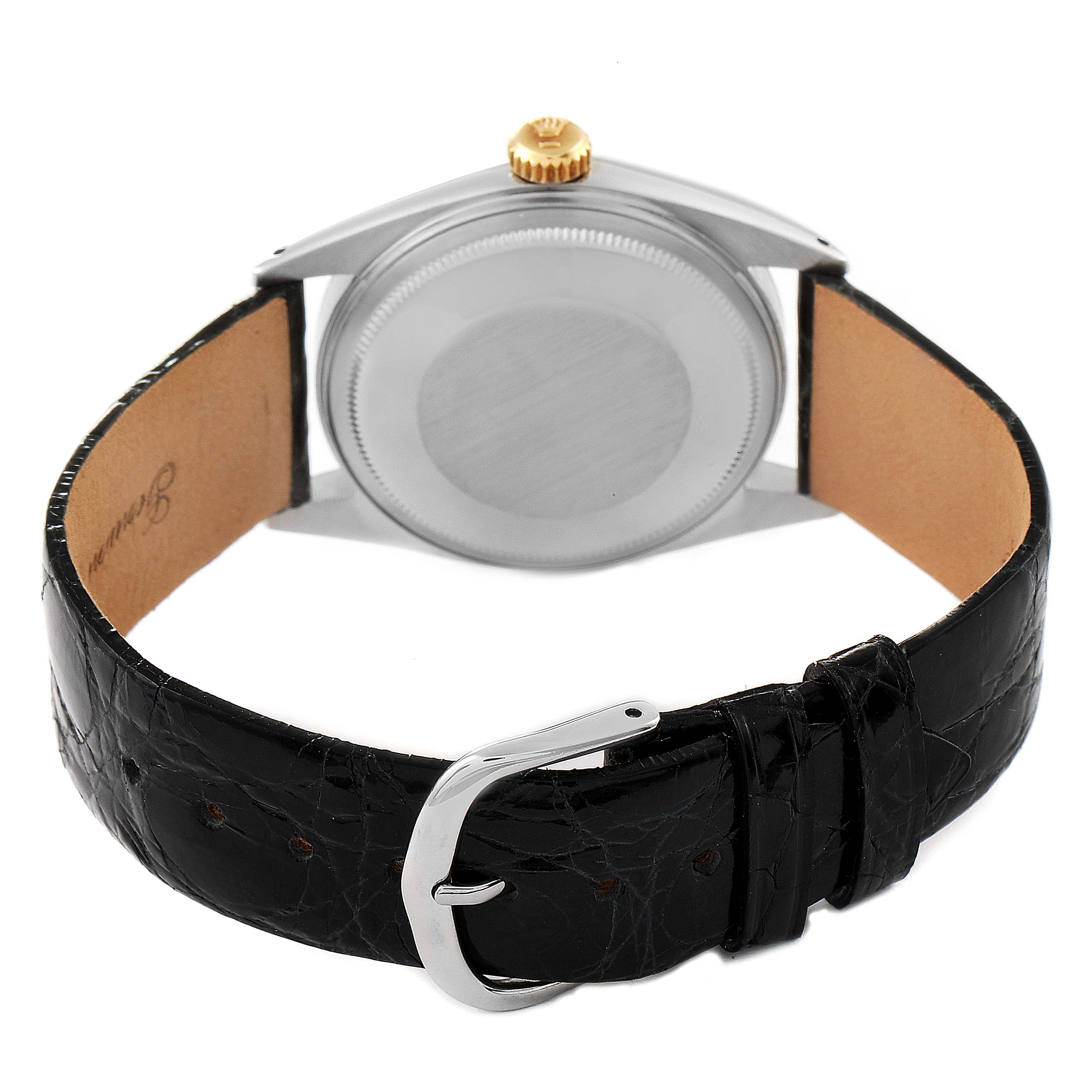 The image shows the back view of a Rolex Vintage Collection 1601 Men's Steel and Gold (two tone) Champagne Dial 1601 Men's Steel and Gold (two tone) Champagne Dial watch, focusing on the case, crown, and leather strap with buckle.