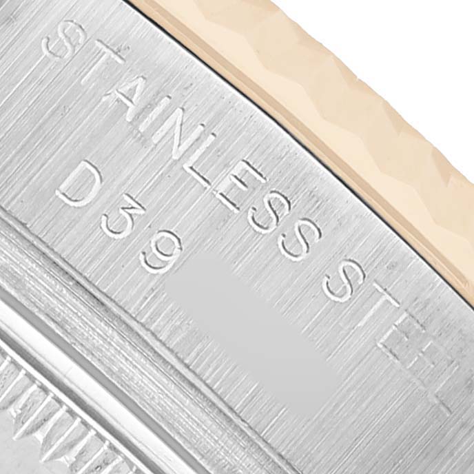 The image shows a close-up of the outer rim and engraved details on a Rolex Datejust 179173 Women's Steel and Gold (two tone) Champagne Dial watch case.