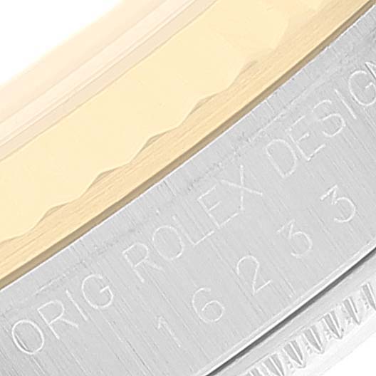 This image shows the edge and engraving on the case of a Rolex Datejust 16233 Men's Steel and Gold (two tone) Champagne Dial 16233 Men's Steel and Gold (two tone) Champagne Dial watch, captured at a close-up angle.