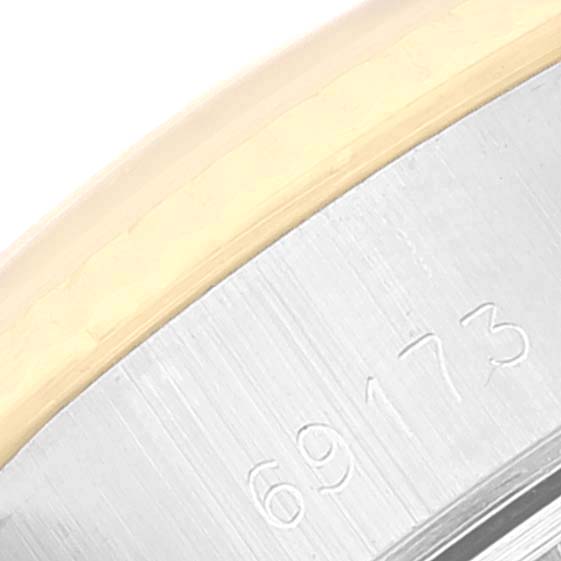 This image shows a close-up of the edge of a stainless steel case with the model number 69173 on a Rolex Datejust 69173 Women's Steel and Gold (two tone) Champagne Dial 69173 Women's Steel and Gold (two tone) Champagne Dial watch.