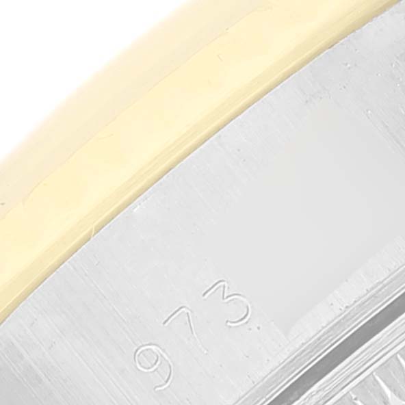 This close-up image shows part of the bezel and case with numbers engraved on the Rolex Datejust 69173 Women's Steel and Gold (two tone) Champagne Dial 69173 Women's Steel and Gold (two tone) Champagne Dial watch.