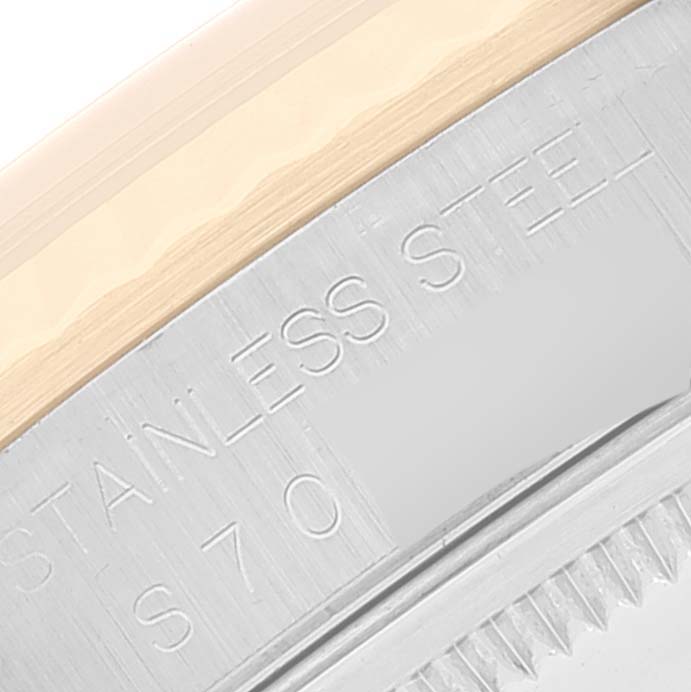 This close-up image shows the side detail of the Rolex Datejust 16233 Men
s Steel and Gold (two tone) Grey Dial 16233 Men
s Steel and Gold (two tone) Grey Dial watch case, highlighting the stainless steel material.