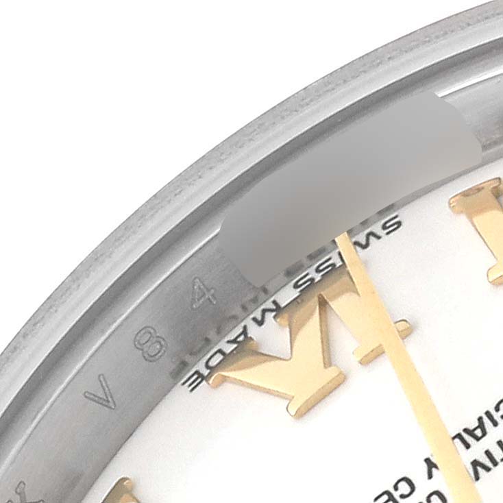 The image shows a close-up view of the bezel and partial dial of a Rolex Datejust 179173 Women's Steel and Gold (two tone) White Dial 179173 Women's Steel and Gold (two tone) White Dial watch.