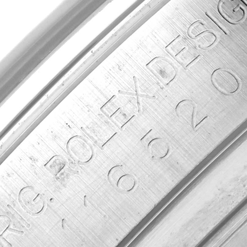 This image shows a close-up angle of the inner case engraving on a Rolex Daytona 116520 Men's Stainless Steel White Dial 116520 Men's Stainless Steel White Dial watch.
