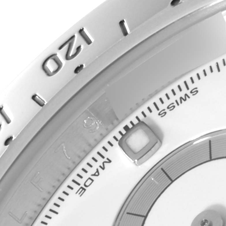 This close-up angle shows the bezel and part of the dial on a Rolex Daytona 116520 Men's Stainless Steel White Dial 116520 Men's Stainless Steel White Dial watch.