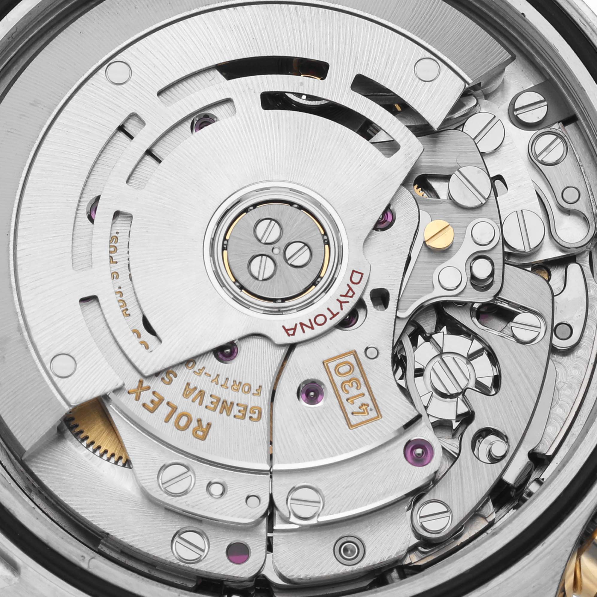 This close-up image shows the intricate internal movement components of a Rolex Daytona 116503 Men's Steel and Gold (two tone) Black Dial 116503 Men's Steel and Gold (two tone) Black Dial watch.