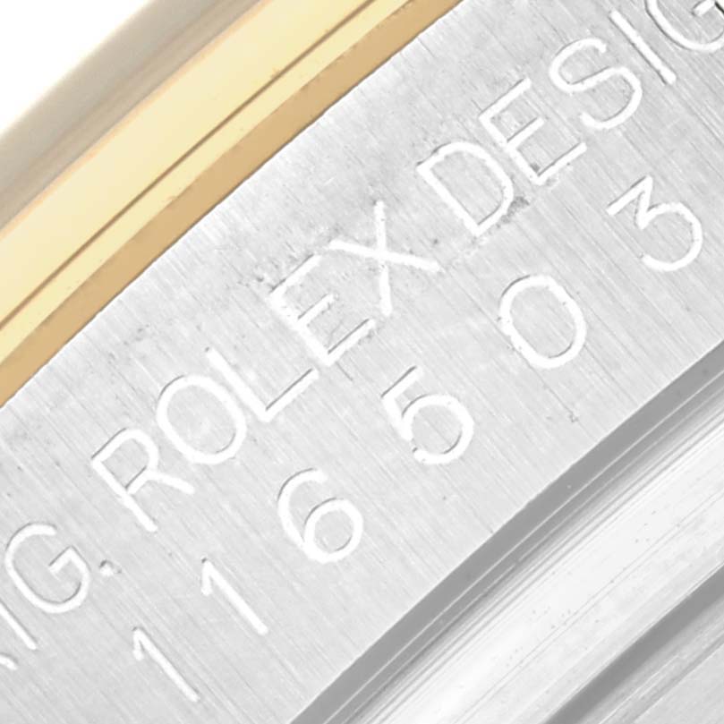 This image shows a close-up of the side engraving on a Rolex Daytona 116503 Men's Steel and Gold (two tone) Black Dial 116503 Men's Steel and Gold (two tone) Black Dial watch, featuring the model number and "ROLEX DESIGN".