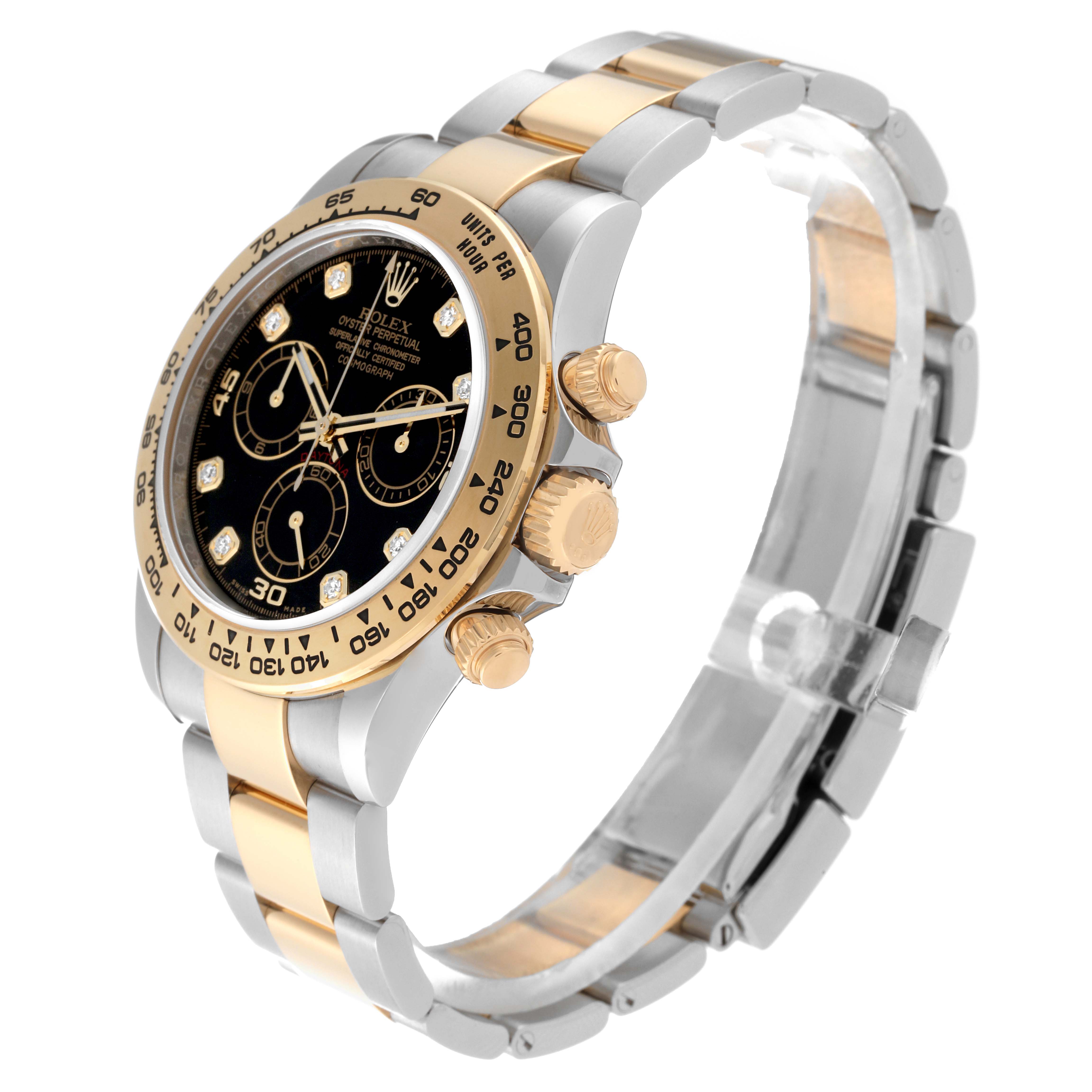 This Rolex Daytona 116503 Men
s Steel and Gold (two tone) Black Dial 116503 Men
s Steel and Gold (two tone) Black Dial model watch is shown at a side angle, highlighting the bezel, crown, pushers, and two-tone bracelet.