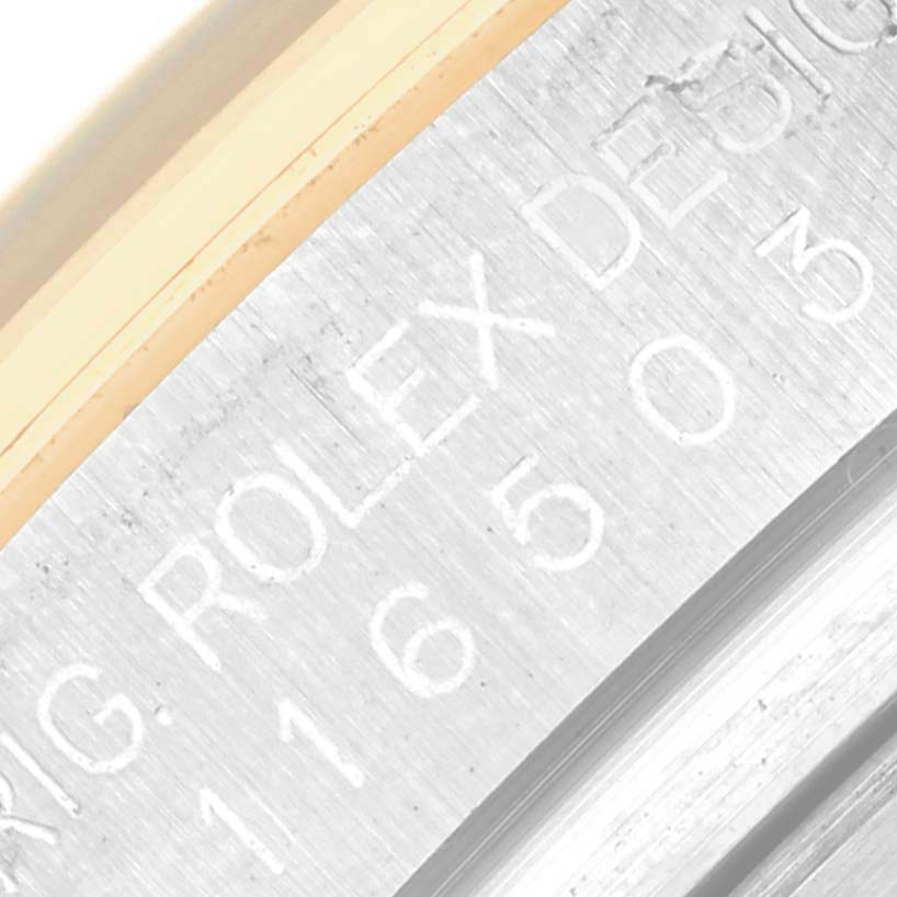 This image shows a close-up of the engraved inner bezel of a Rolex Daytona 116503 Men
s Steel and Gold (two tone) Black Dial 116503 Men
s Steel and Gold (two tone) Black Dial watch.