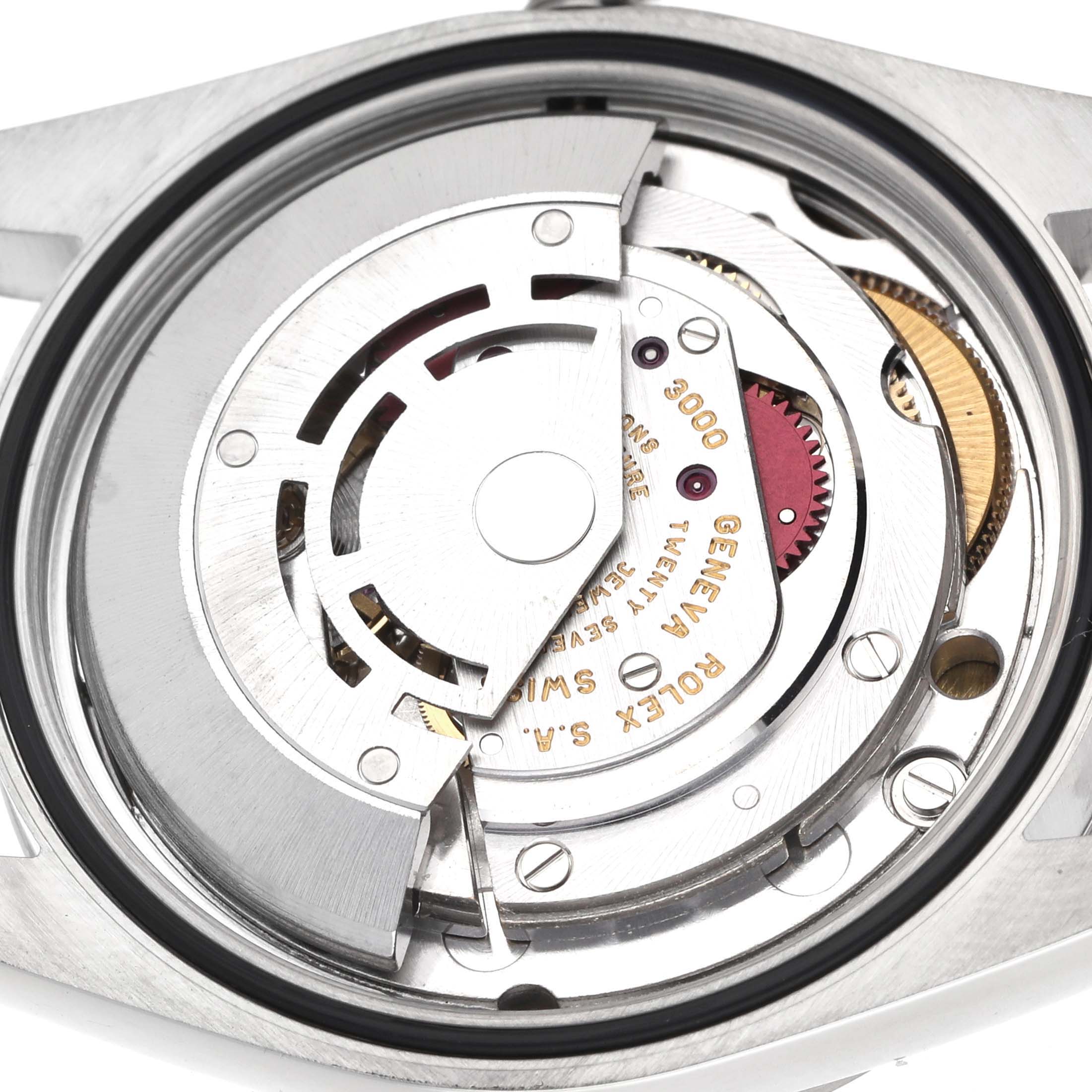 The image shows the Rolex Explorer 14270 Men's Stainless Steel Black Dial's movement from the back, highlighting gears and intricate mechanical parts.