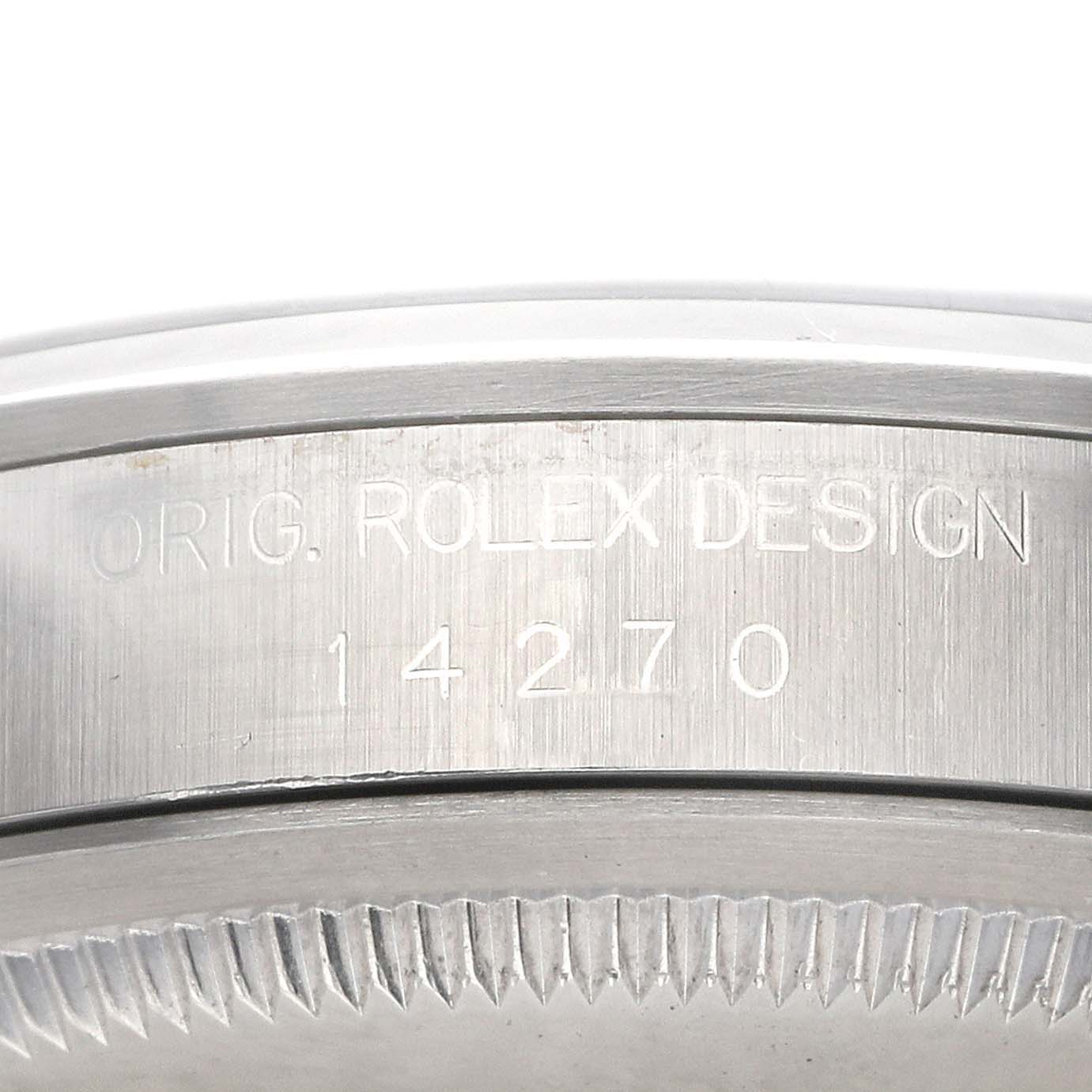 The image shows the case side of a Rolex Explorer 14270 Men's Stainless Steel Black Dial, model 14270, with engraved serial information.
